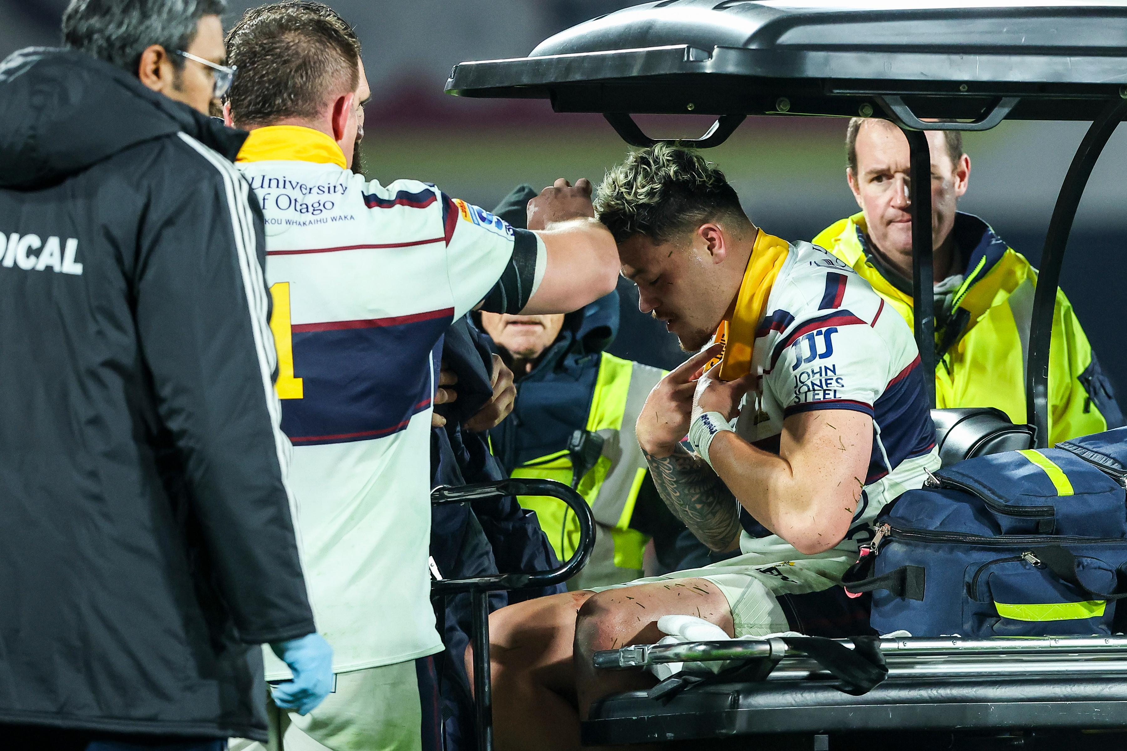 Caleb Tangitau left the field on a medicab after an injury in the final minutes of the Highlanders' loss to the Chiefs. Photo / Photosport