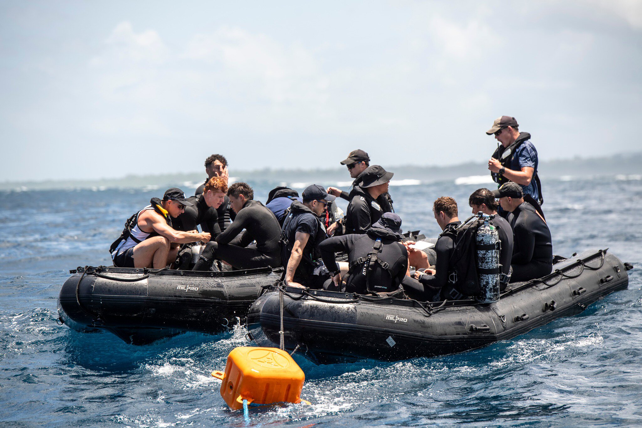 Navy divers prepare to set out and recover items from the HMNZS Manawanui. Photo / Sergeant Vanessa Parker