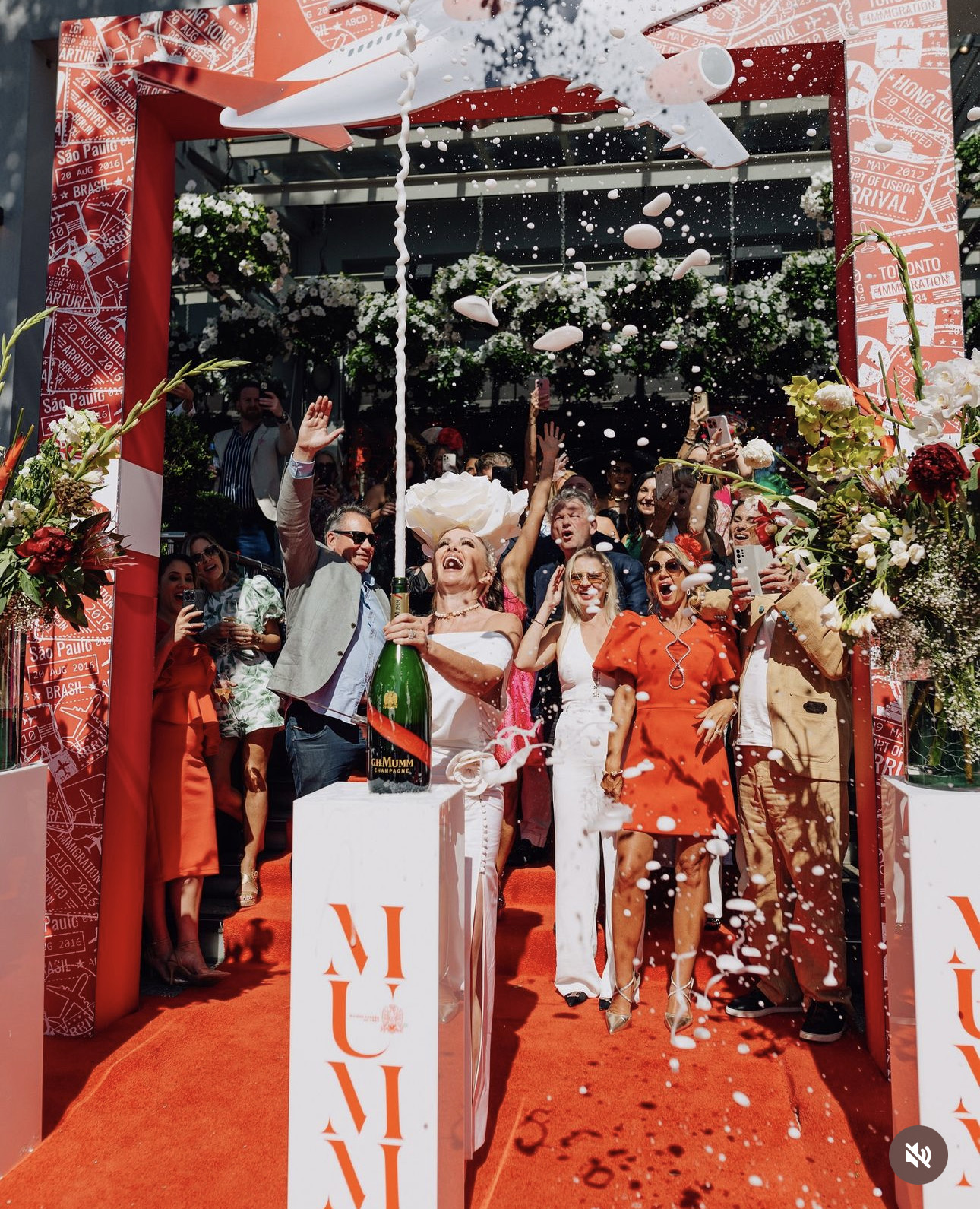 Hartfields Jewellers' owner Jodie Dick opens Soul Bar's Melbourne Cup celebrations by opening a bottle of Champagne by sabrage.