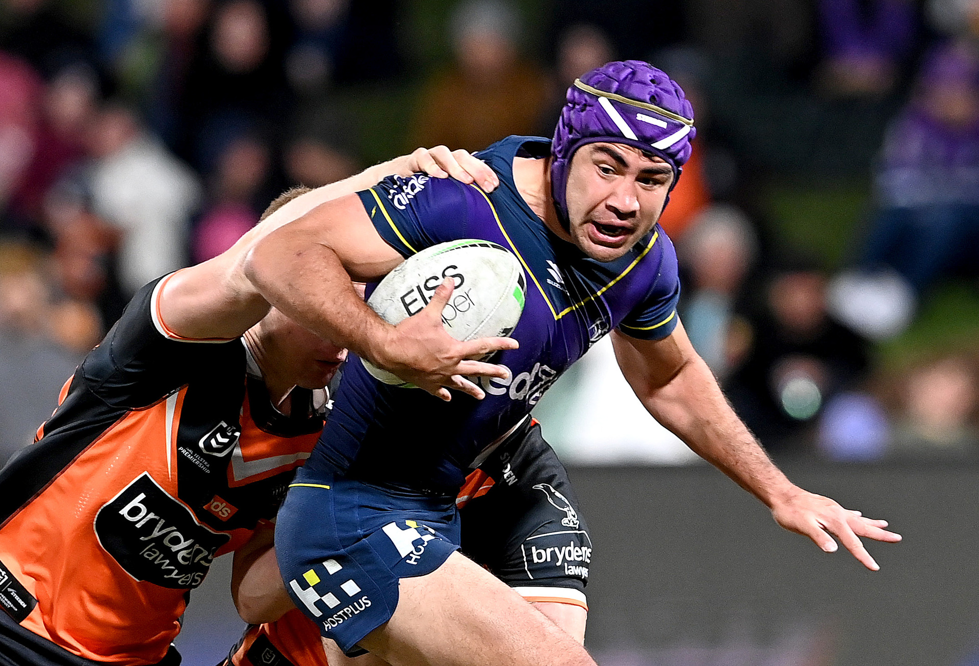 Jahrome Hughes of the Storm attempts to break away from the defence during the round 15 NRL match between the Melbourne Storm and the Wests Tigers. Photo / Getty Images.