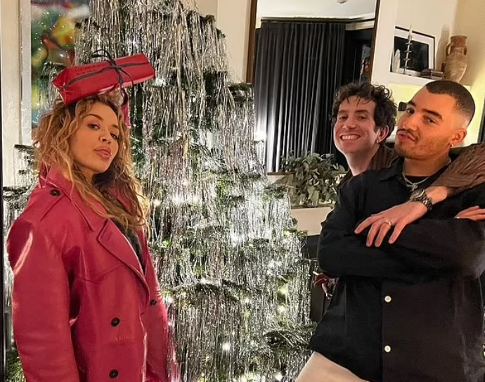 Rita Ora posed with friends in front of a festive Christmas tree. Photo / Instagram