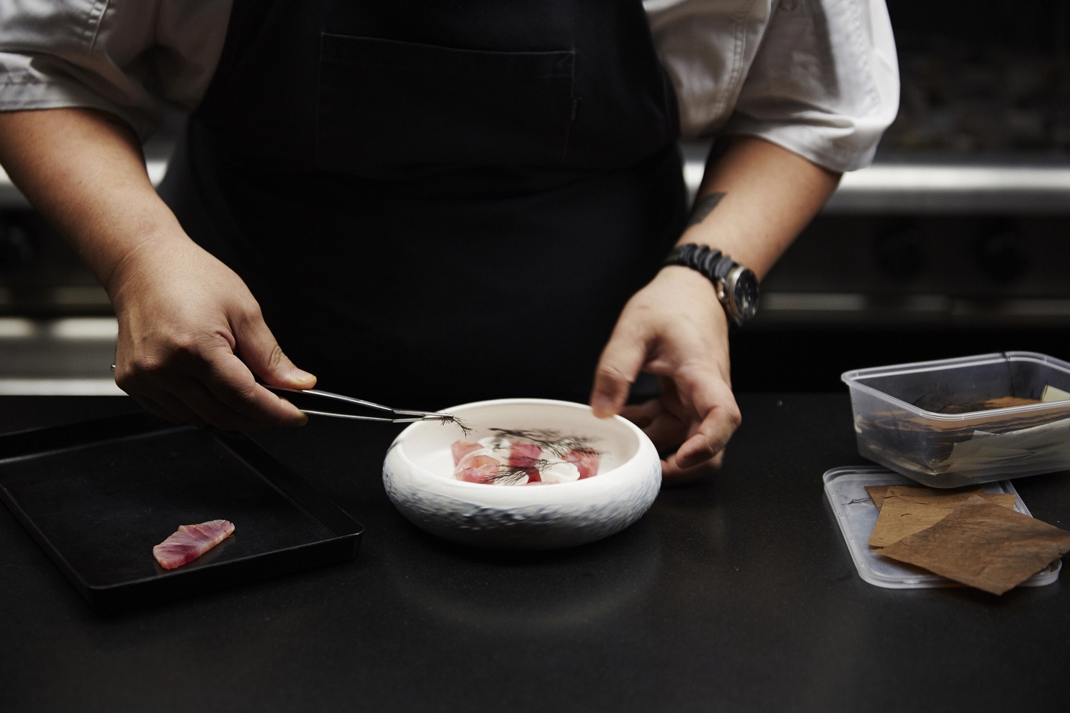 Clooney's current chef Nobu Lee plates up a dish. Photo / Rebecca Zephyr Thomas