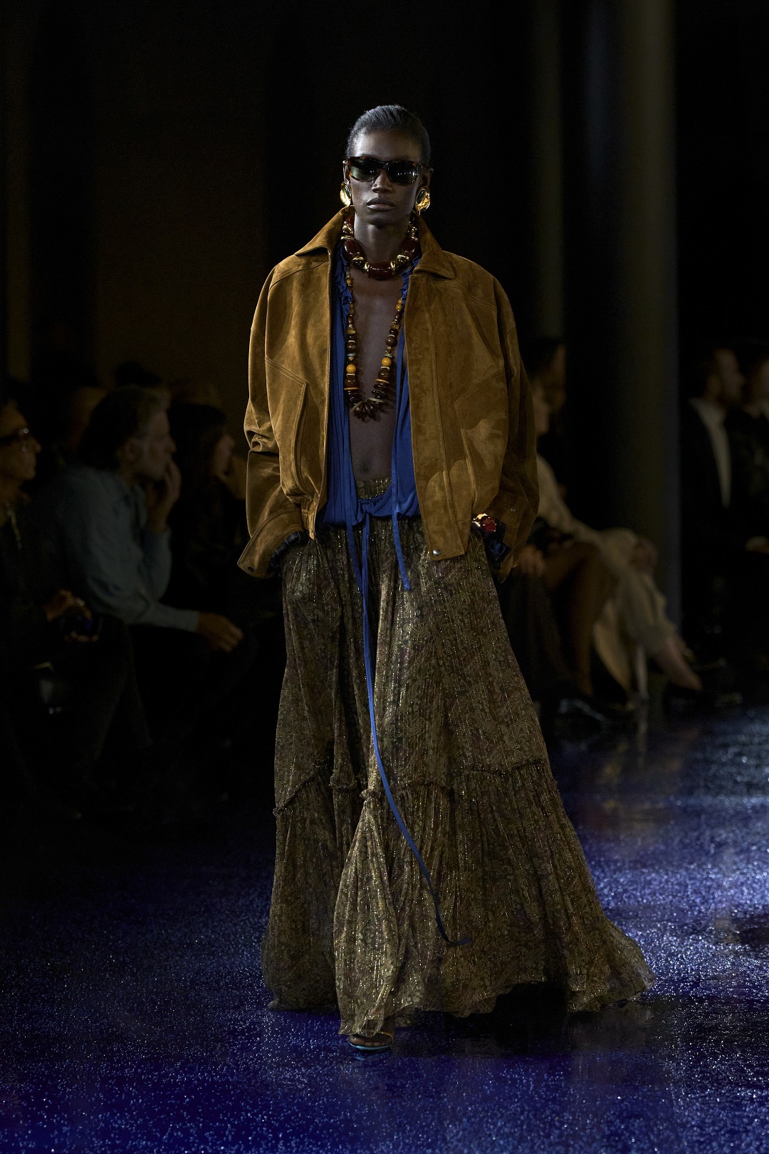 A tiered chiffon maxi dress contrasted with a suede jacket.