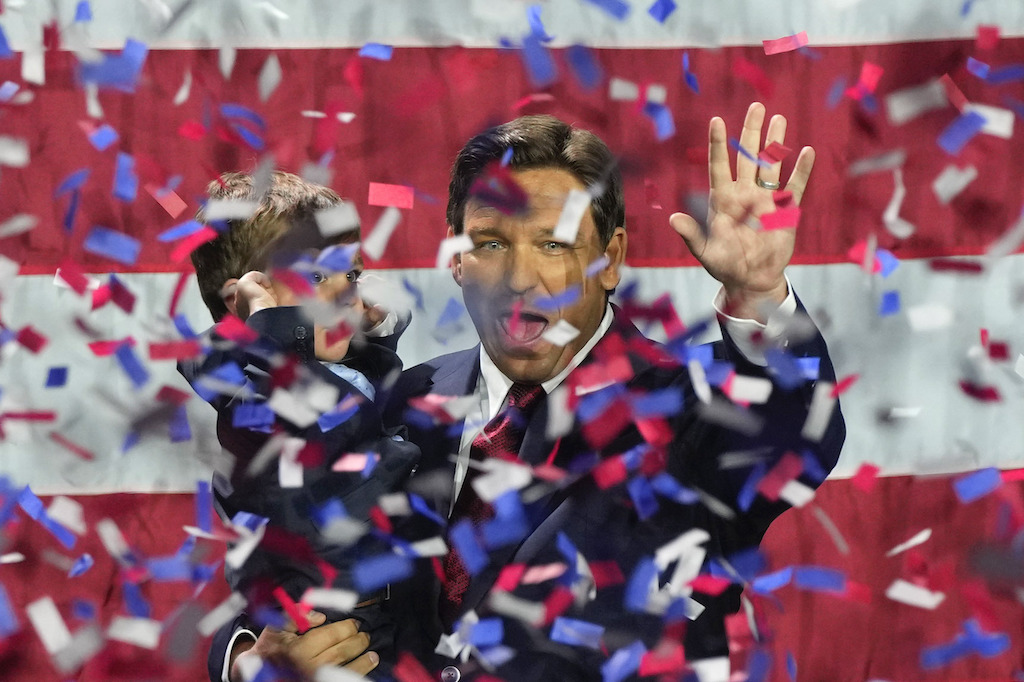 Incumbent Florida Republican Governor Ron DeSantis holds his son Mason as he celebrates winning reelection, at an election night party in Tampa. Photo / AP