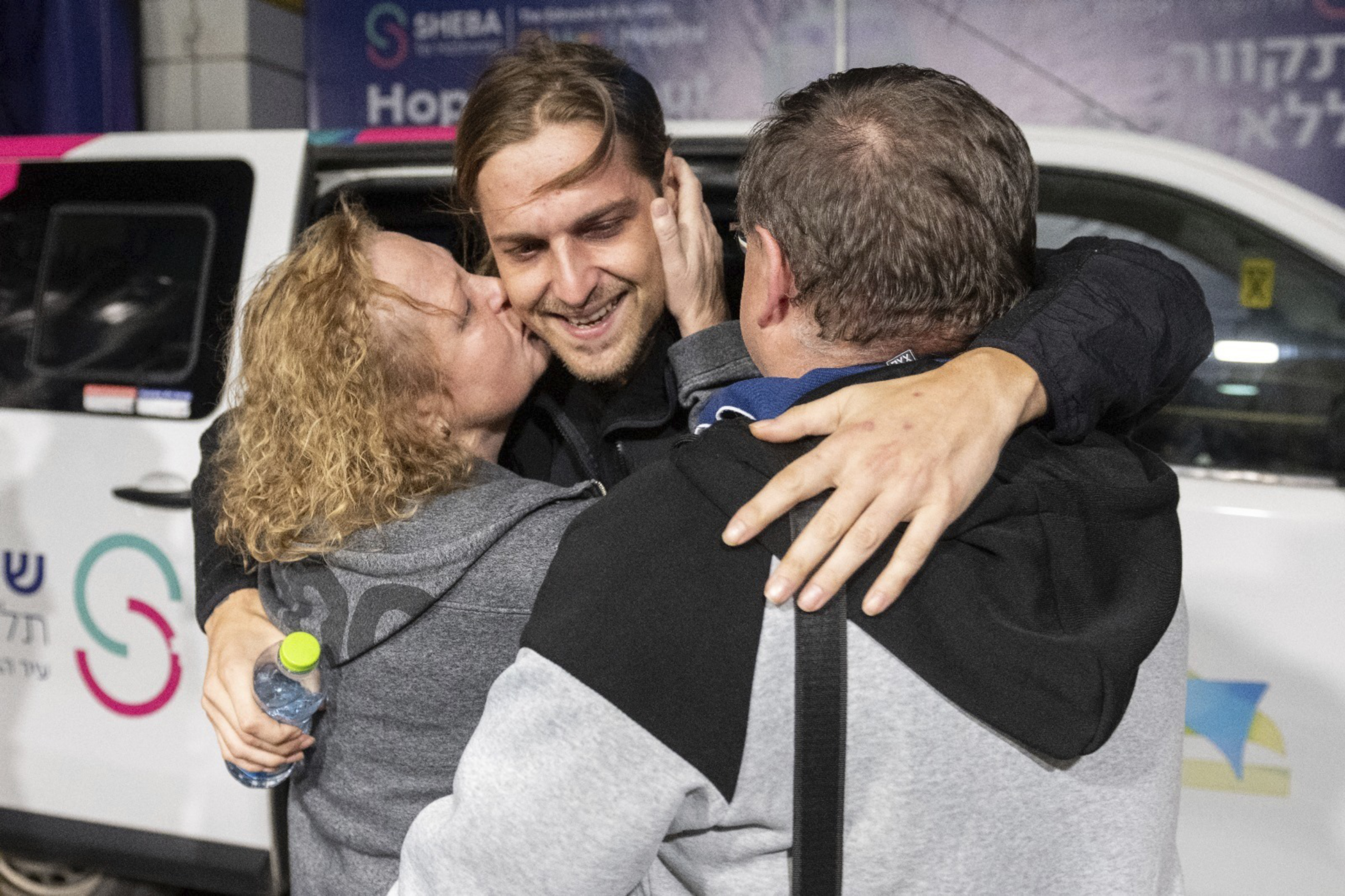 This photo released by the GPO, Ron Krivoi meets his parents at the Sheba Medical Centre. Photo / AP