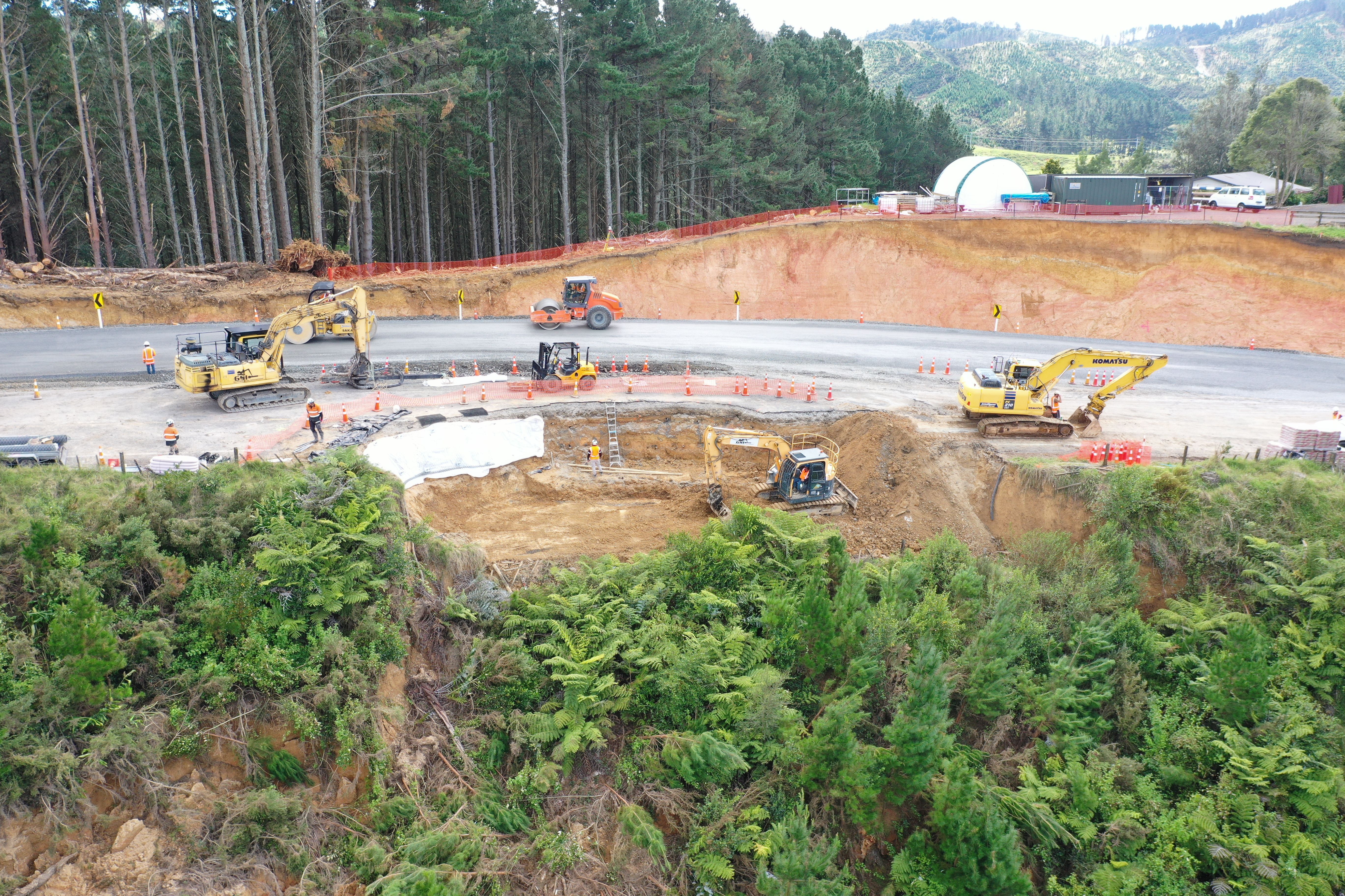 The new temporary diverson road on SH23 is raised to protect the fibre optic cable running under the site. Photo / Waka Kotahi