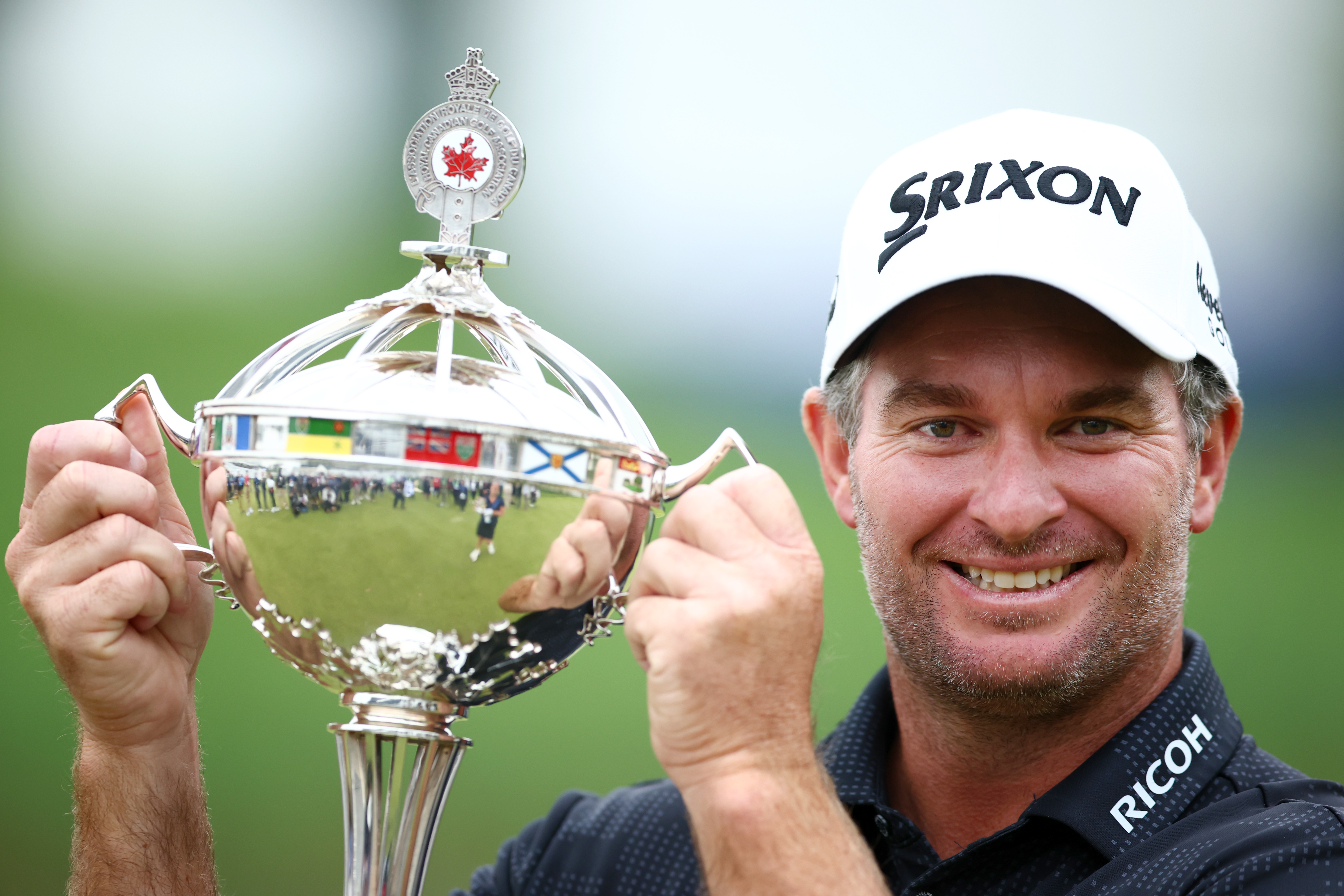 Ryan Fox poses with the trophy after putting in to win in a four hole playoff and claim the Canadian Open. Photo / Getty Images