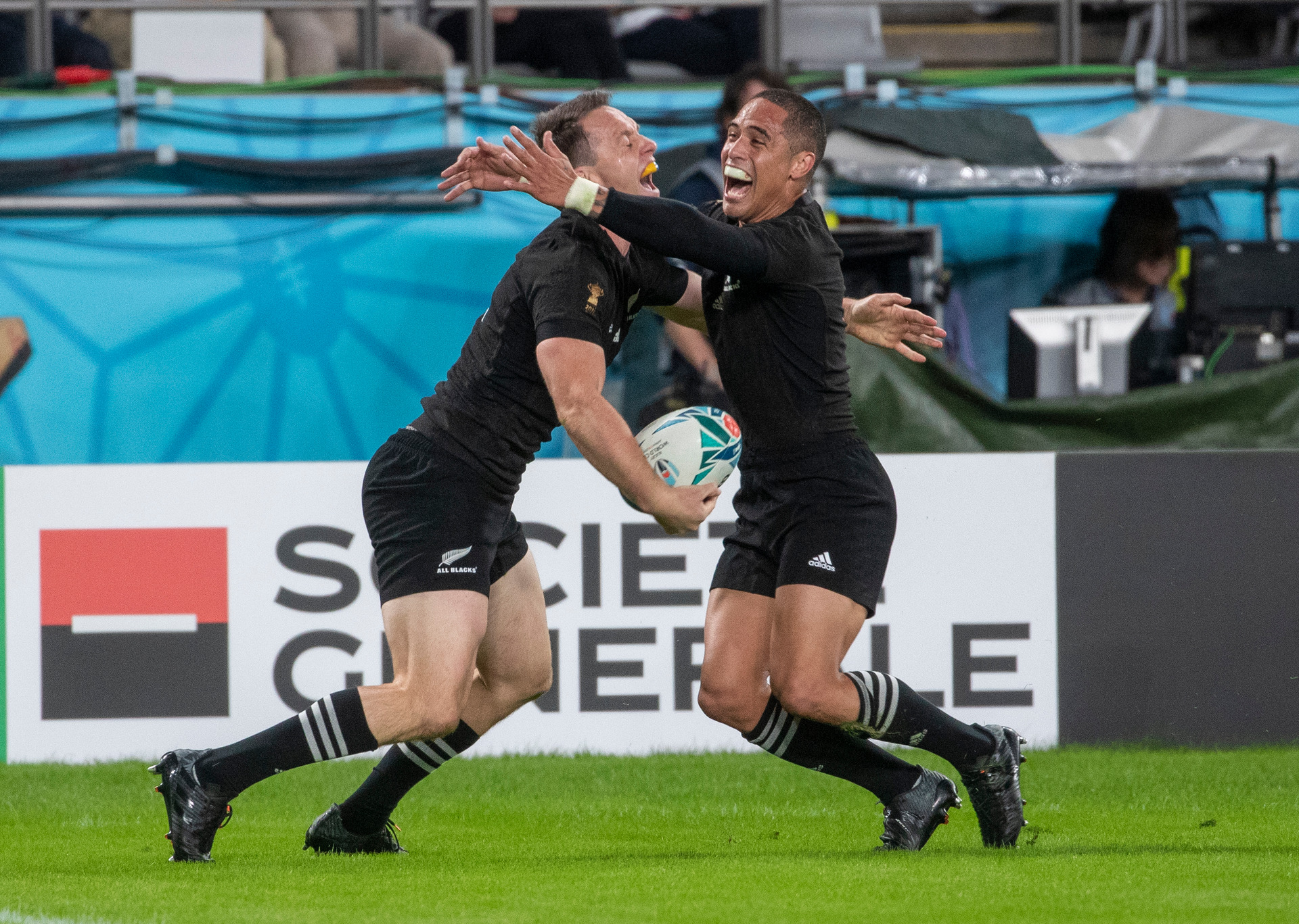 All Blacks wing Ben Smith (left) is hugged by Aaron Smith after scoring his second try against Wales. Photo / Mark Mitchell