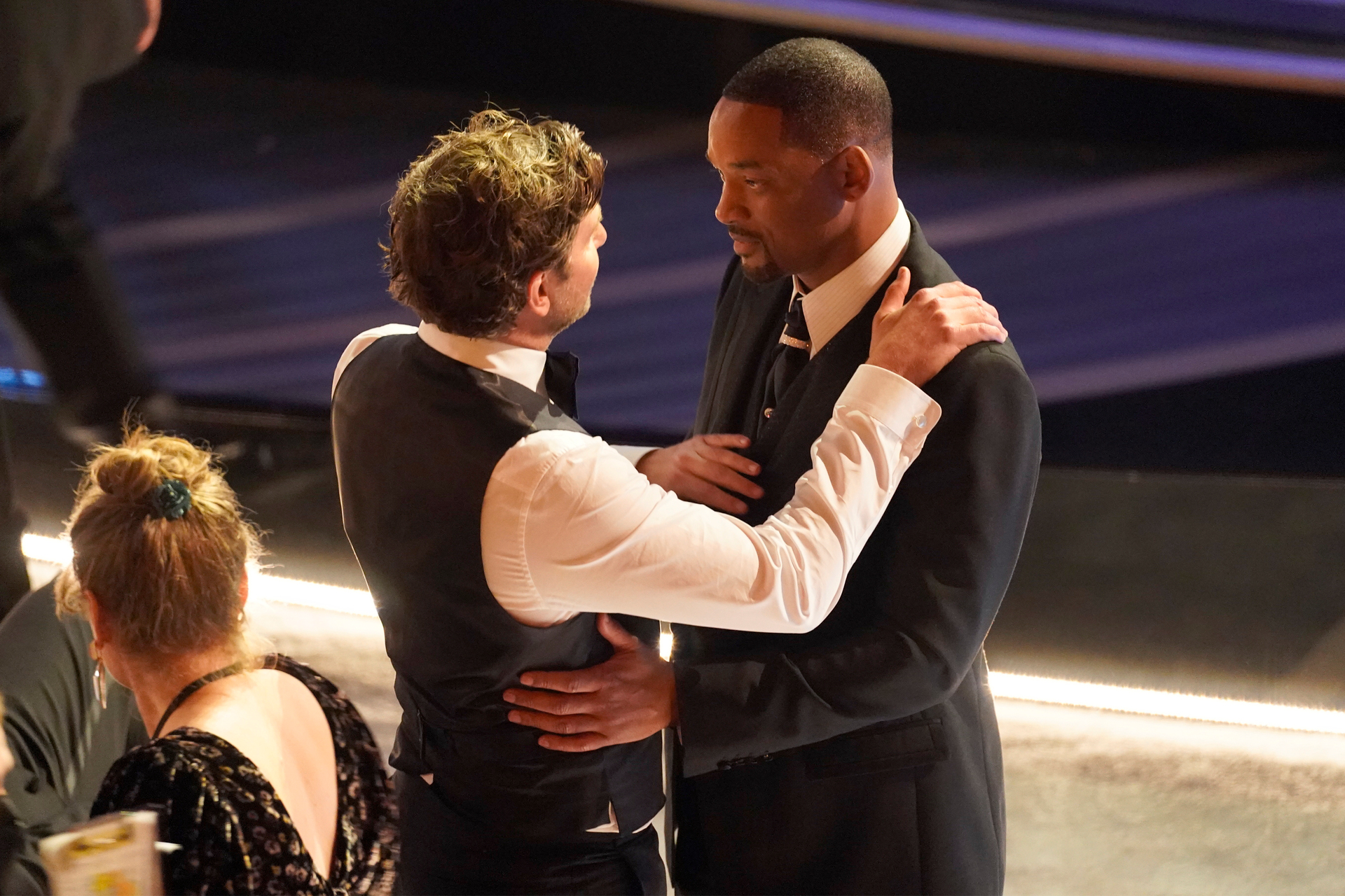 Bradley Cooper, left, and Will Smith appear in the audience at the Oscars on Sunday, March 27, 2022, at the Dolby Theatre in Los Angeles. Photo / AP