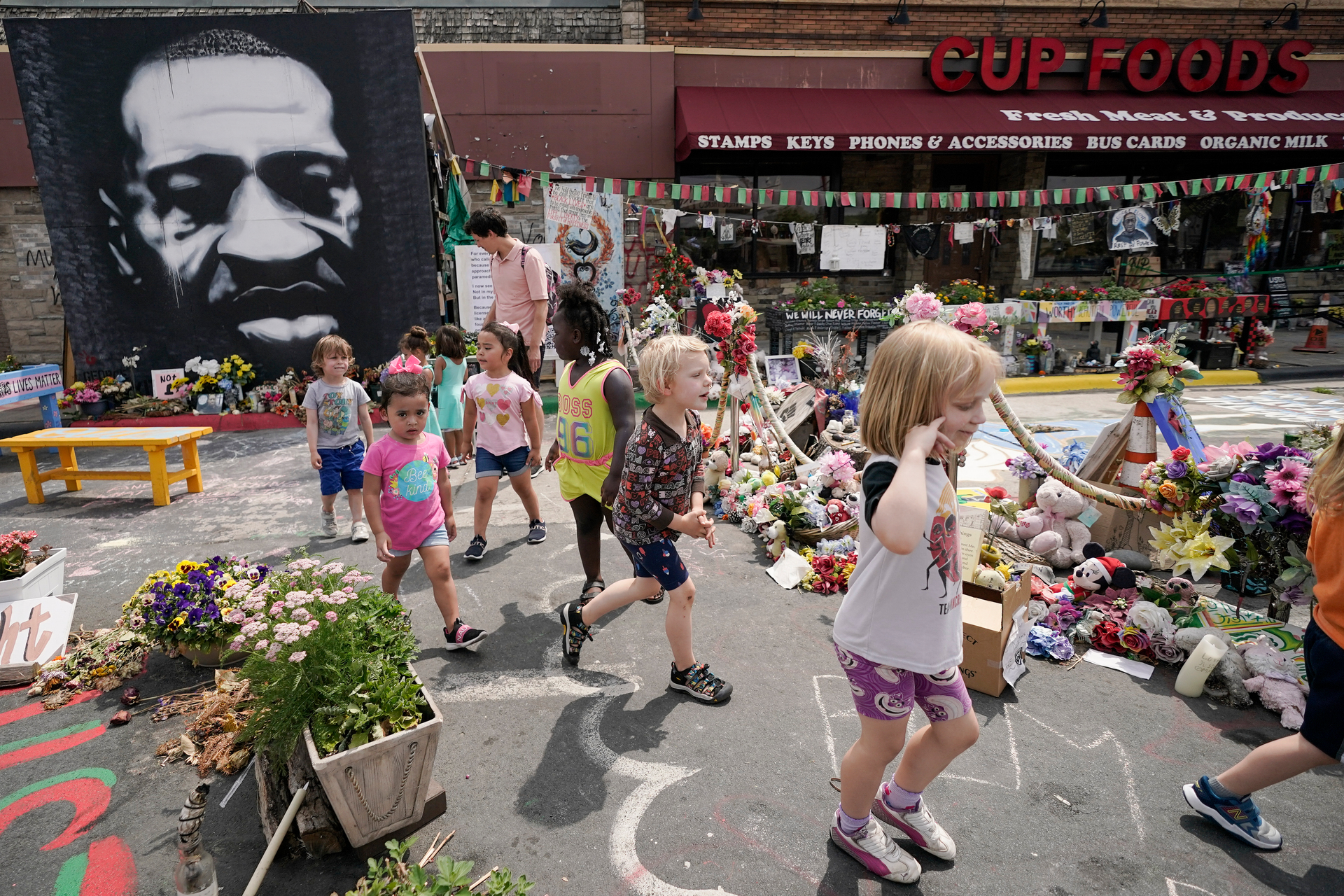 Preschool children visit the site where George Floyd was murdered by then Minneapolis Police officer Derek Chauvin. Photo / AP