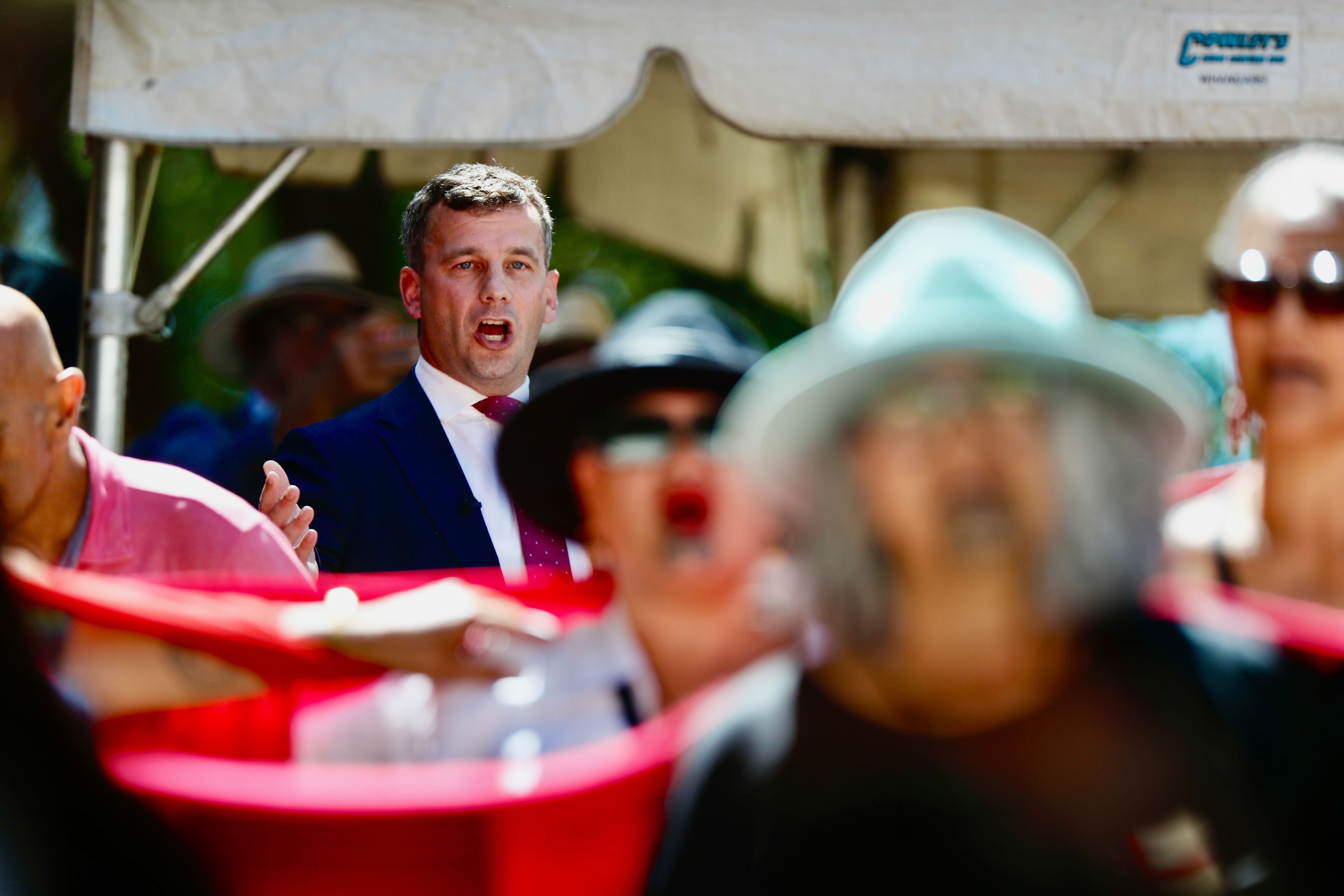 Protesters turn their backs on Act leader David Seymour during his speech at the Waitangi Treaty Grounds marae. Photo / Dean Purcell