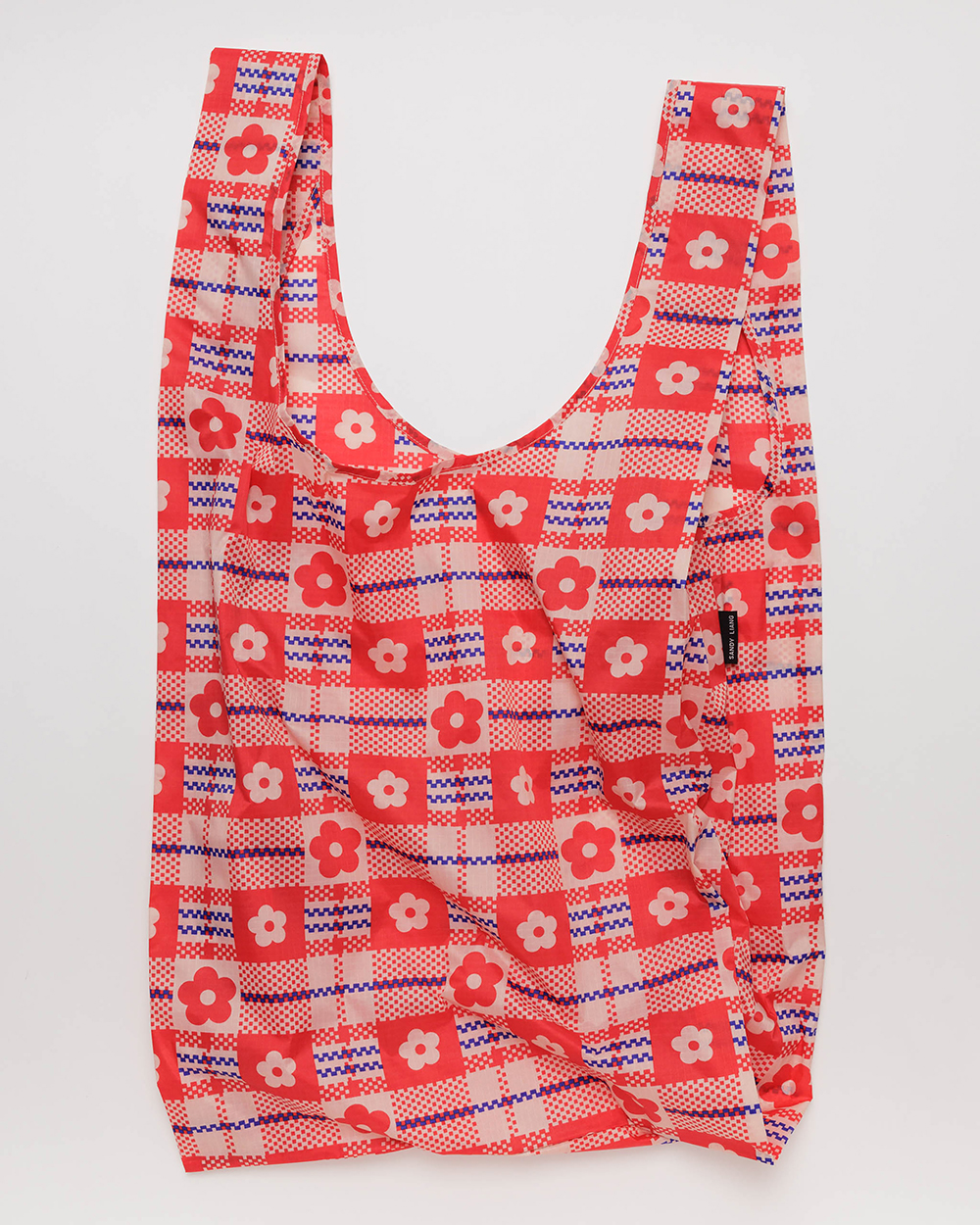 In an undated image provided via Baggu, a tote bag with a red floral plaid print from Sandy Liang's collection with Baggu. Photo / Via Baggu via The New York Times
