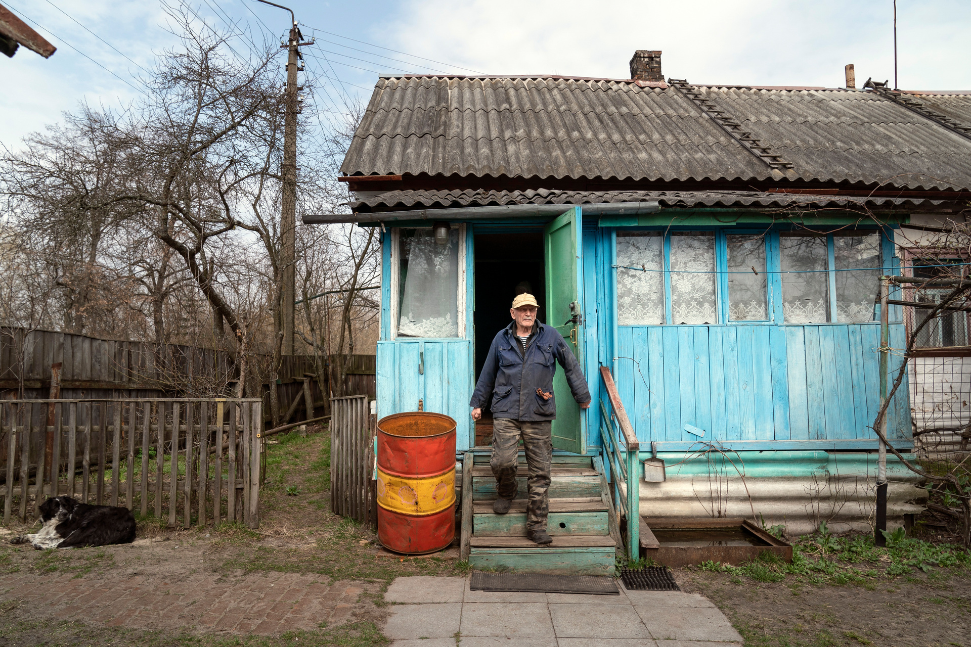 Yevgeny Markevich, a 85-year-old former teacher, leaves his house at the Chernobyl exclusion zone. Photo / AP