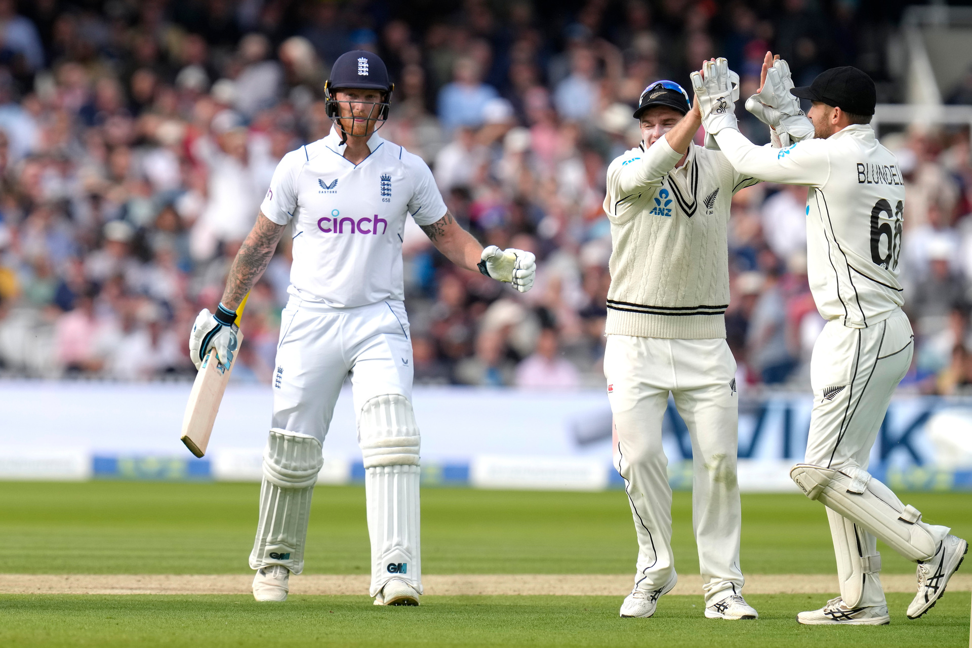 New Zealand's Tom Blundell, right, celebrates catching out England's Ben Stokes, left, during the third day of the test match between England and New Zealand. Photo / AP