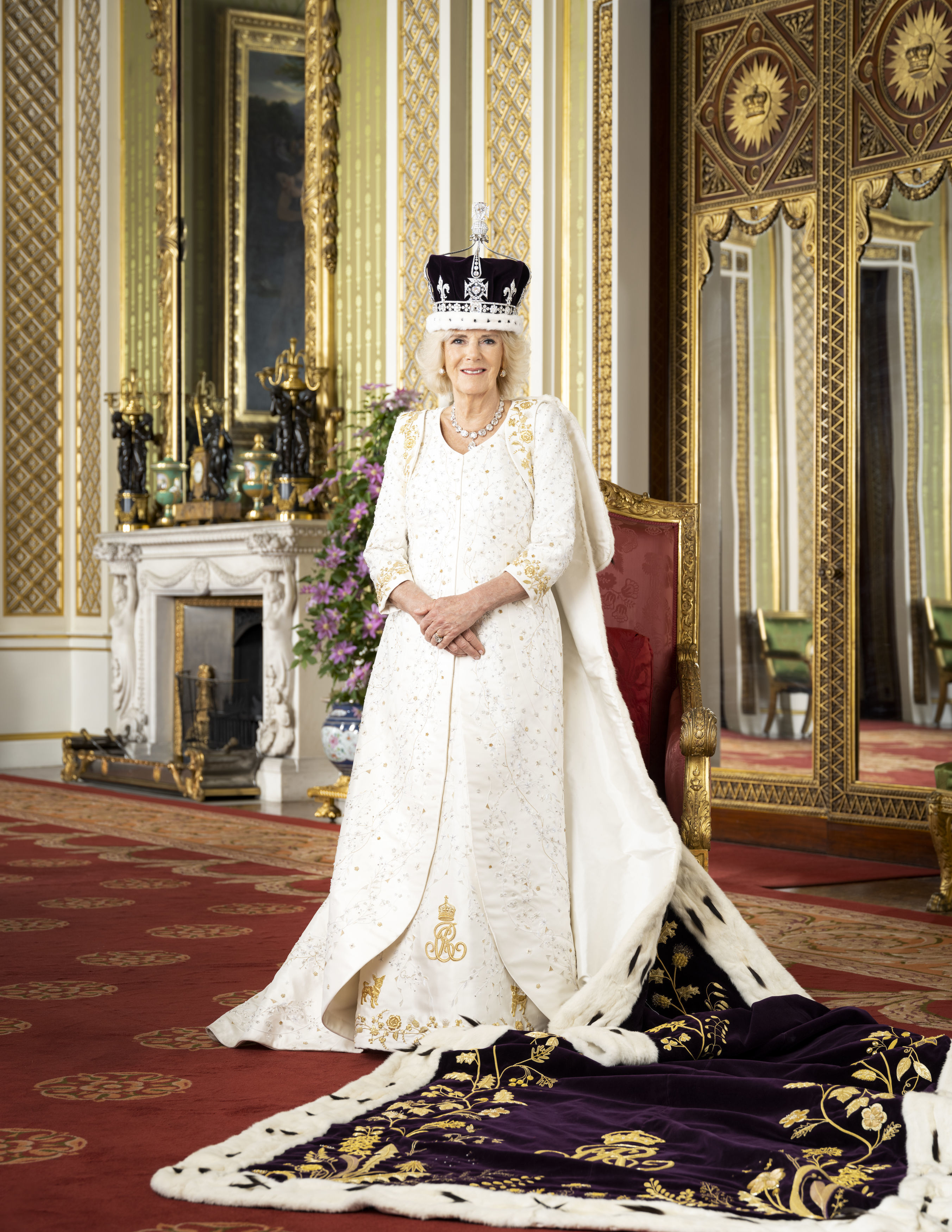 Britain's Queen Camilla poses for a photo in The Green Drawing Room of Buckingham Palace, London. The Queen is wearing Queen Mary's Crown and Robe of Estate. Photo / AP