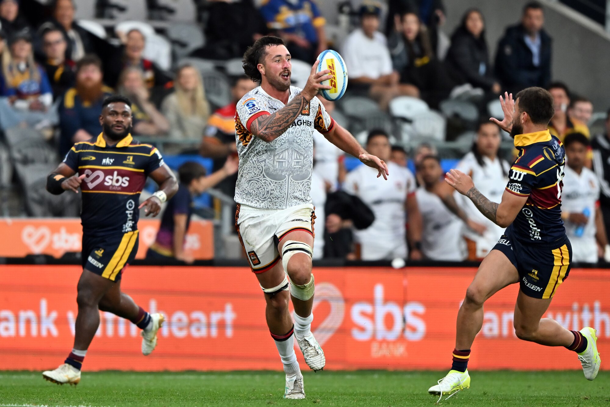The Chiefs' Josh Lord on the run against the Highlanders. Photo / Getty Images