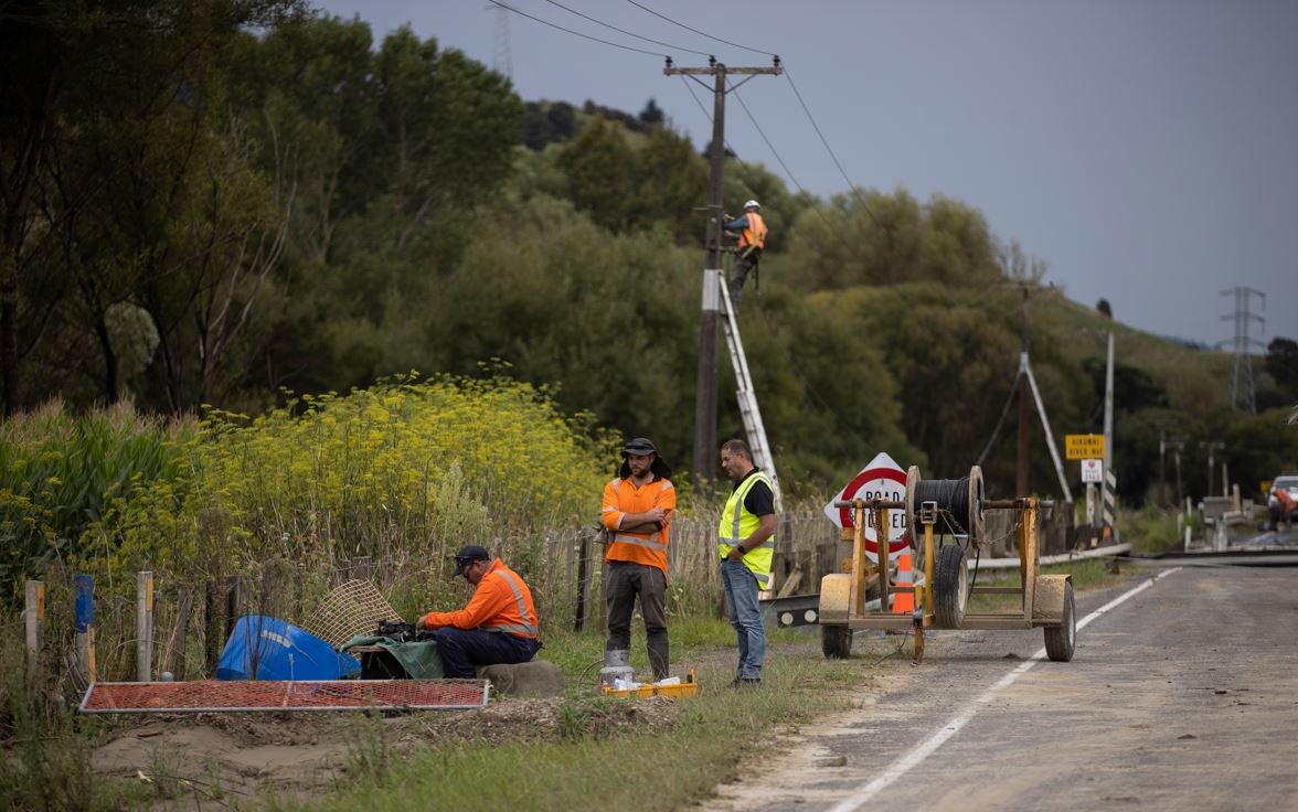Chorus staff repairing fibre optic cable to Hawke’s Bay and Gisborne after a bridge was washed away by Cyclone Gabrielle. Photo / George Heard