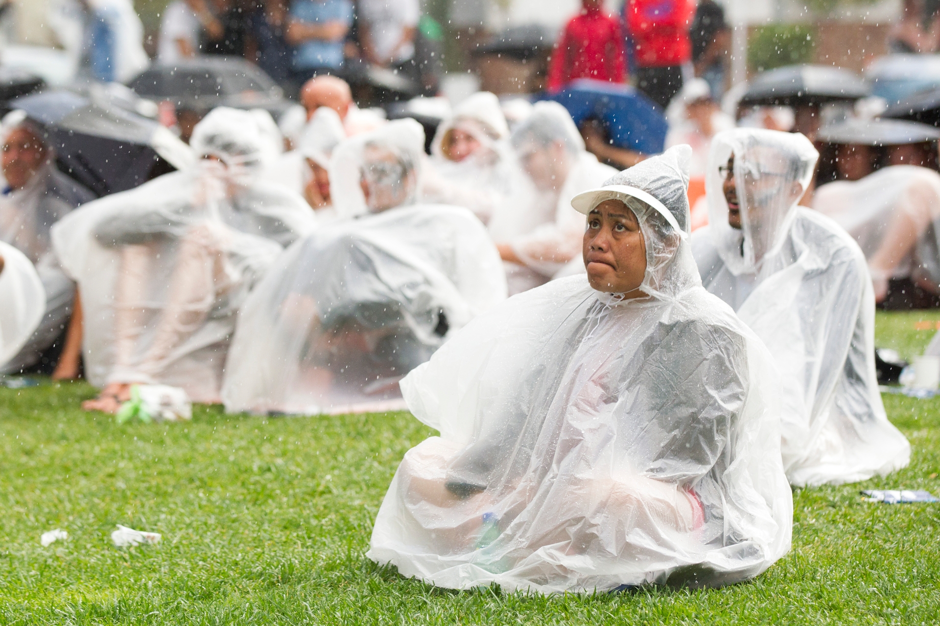 Cricket supporters watching at the Takutai Square fanzone in Auckland, where fans took up the offer of free ponchos. Photo / Jason Oxenham