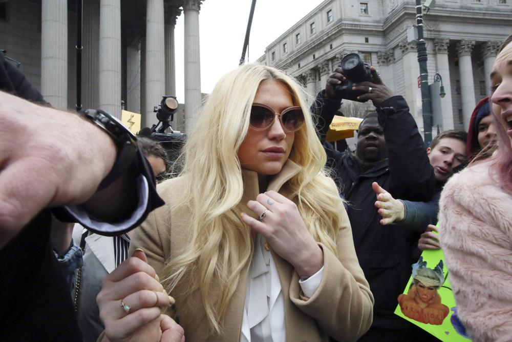 Kesha leaves Supreme Court in New York after a hearing involving her producer, Dr Luke, in 2016. Photo / AP