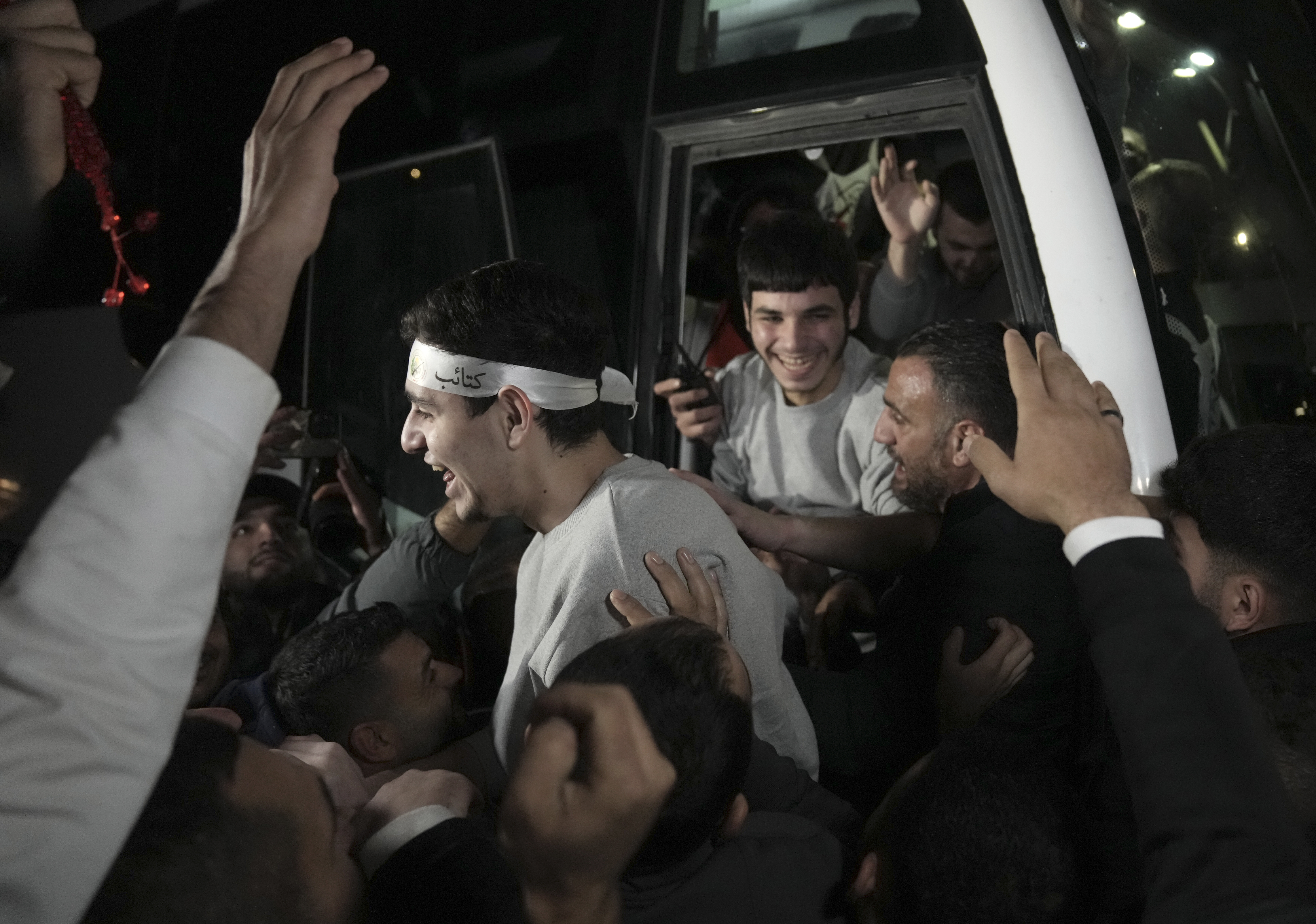 Released Palestinian prisoners arrive in the West Bank town of Ramallah on Tuesday. Photo / AP