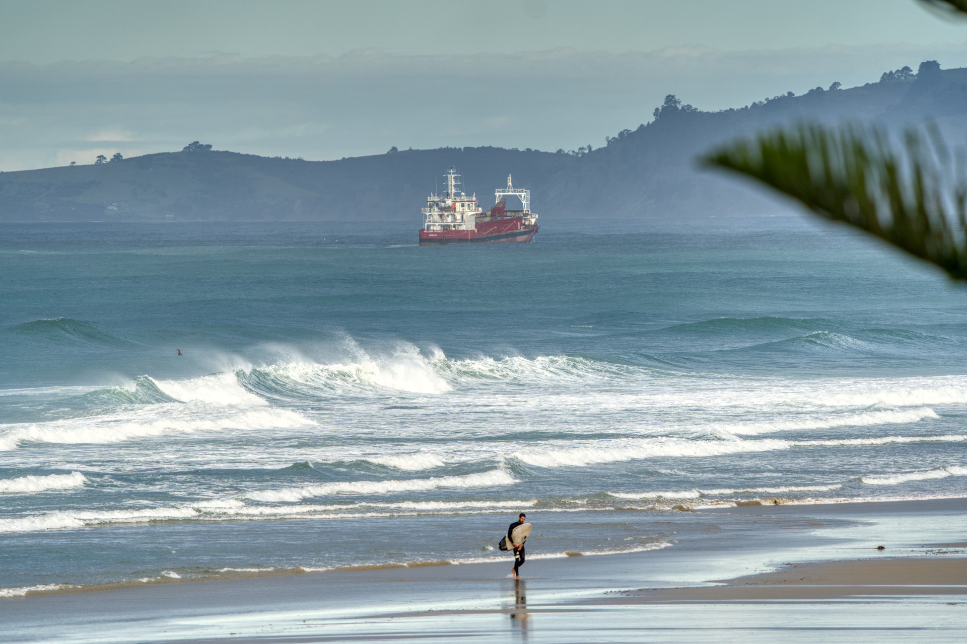 The McCallum Bros' mining vessel has become a common site along the Pakiri coast. Photo / Doug Moores