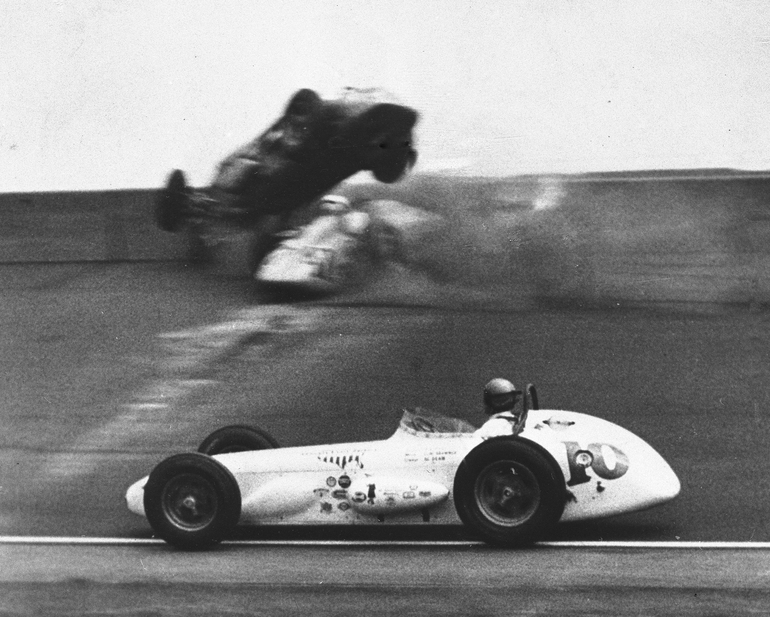 A.J. Foyt (10) passes a crash between drivers Mike Magill, top, and Chuck Weyant during the 43rd running of the Indianapolis 500 auto race at Indianapolis Motor Speedway in Indianapolis, Ind., on May 30, 1959. Photo / AP