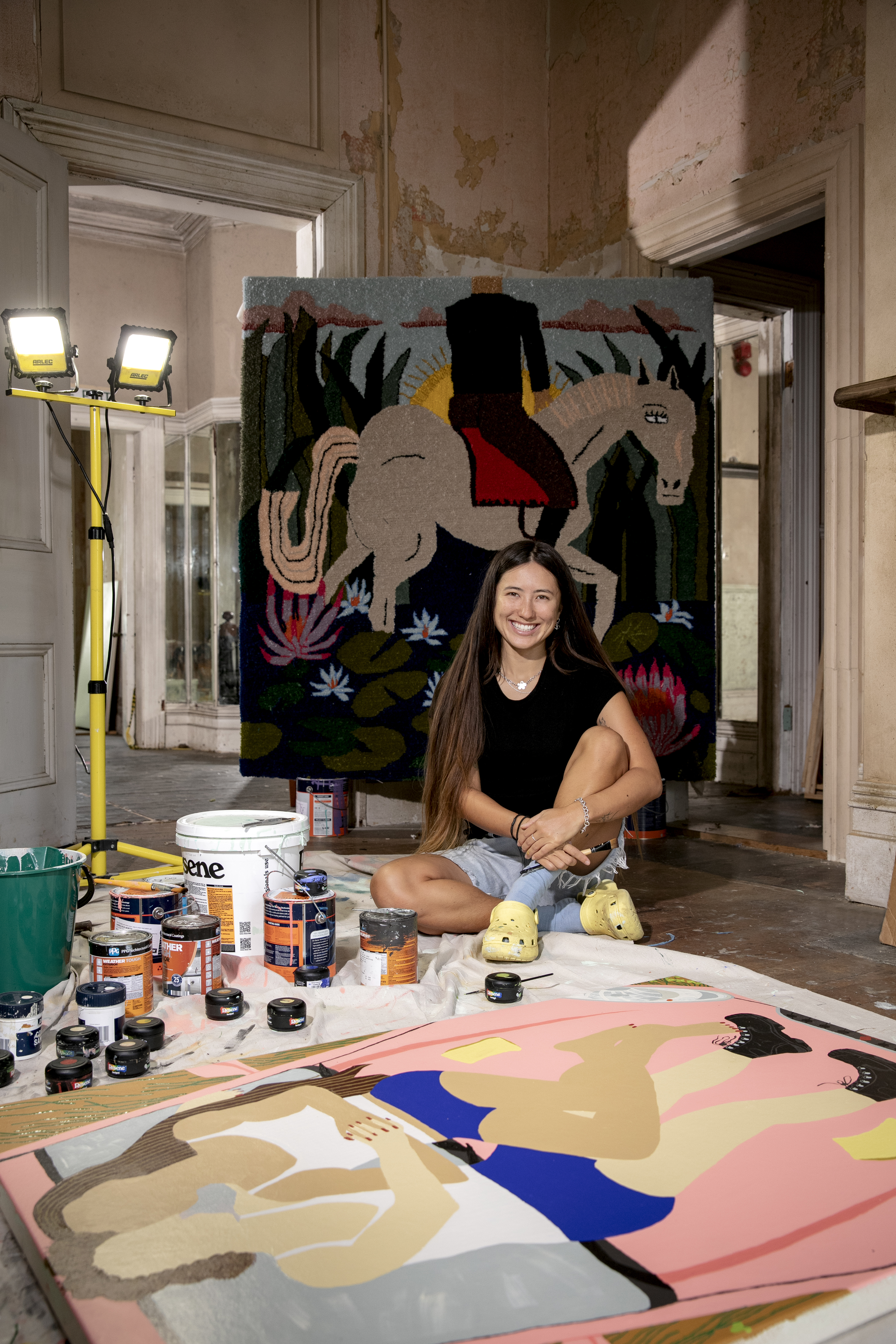 On the floor is a painting depicting Claudia and her girlfriend. Photo / Babiche Martens