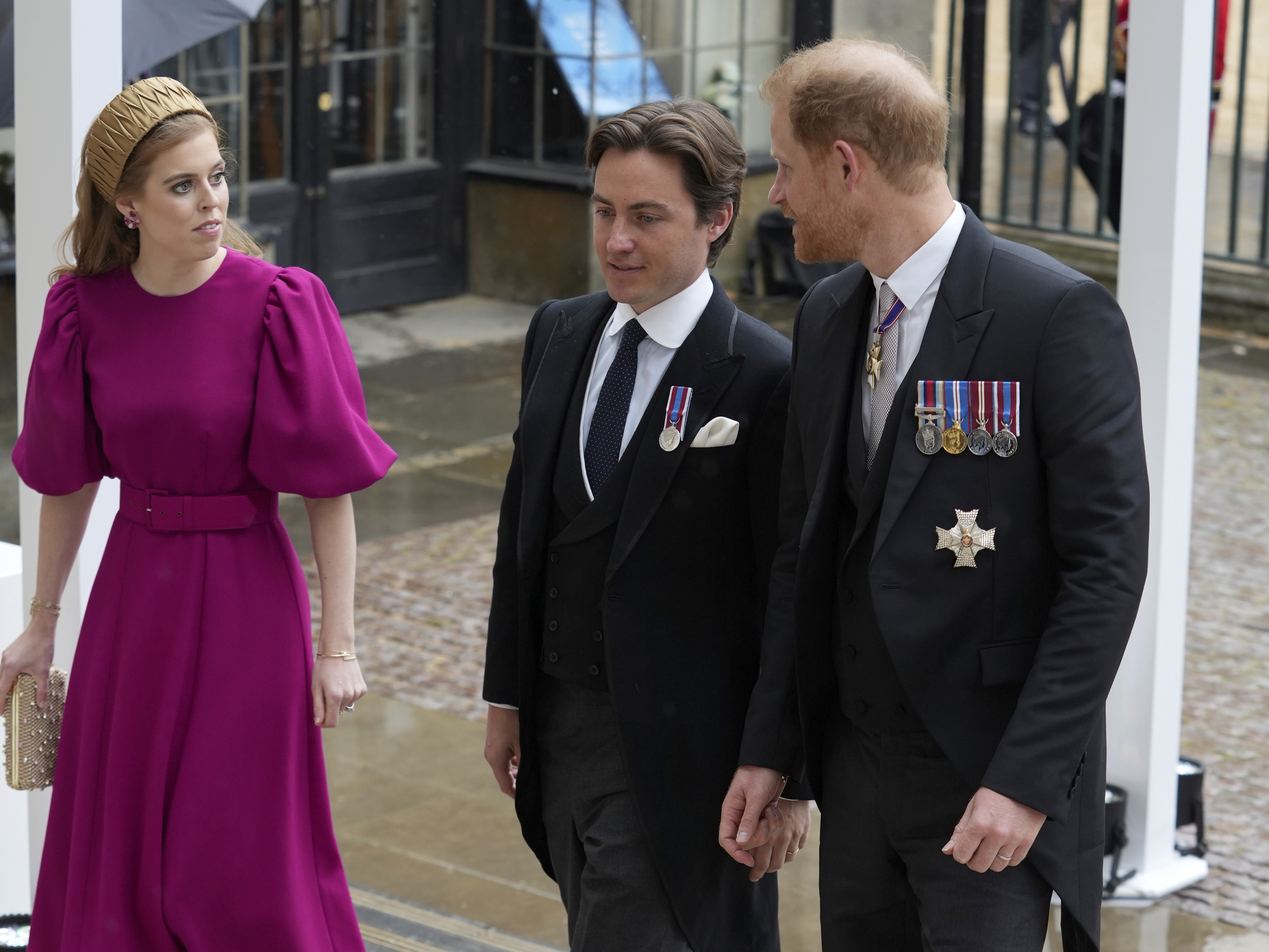 Britain's Prince Harry, right, Princess Beatrice, left, and Edoardo Mapelli Mozzi arrive at Westminster Abbey. Photo / AP