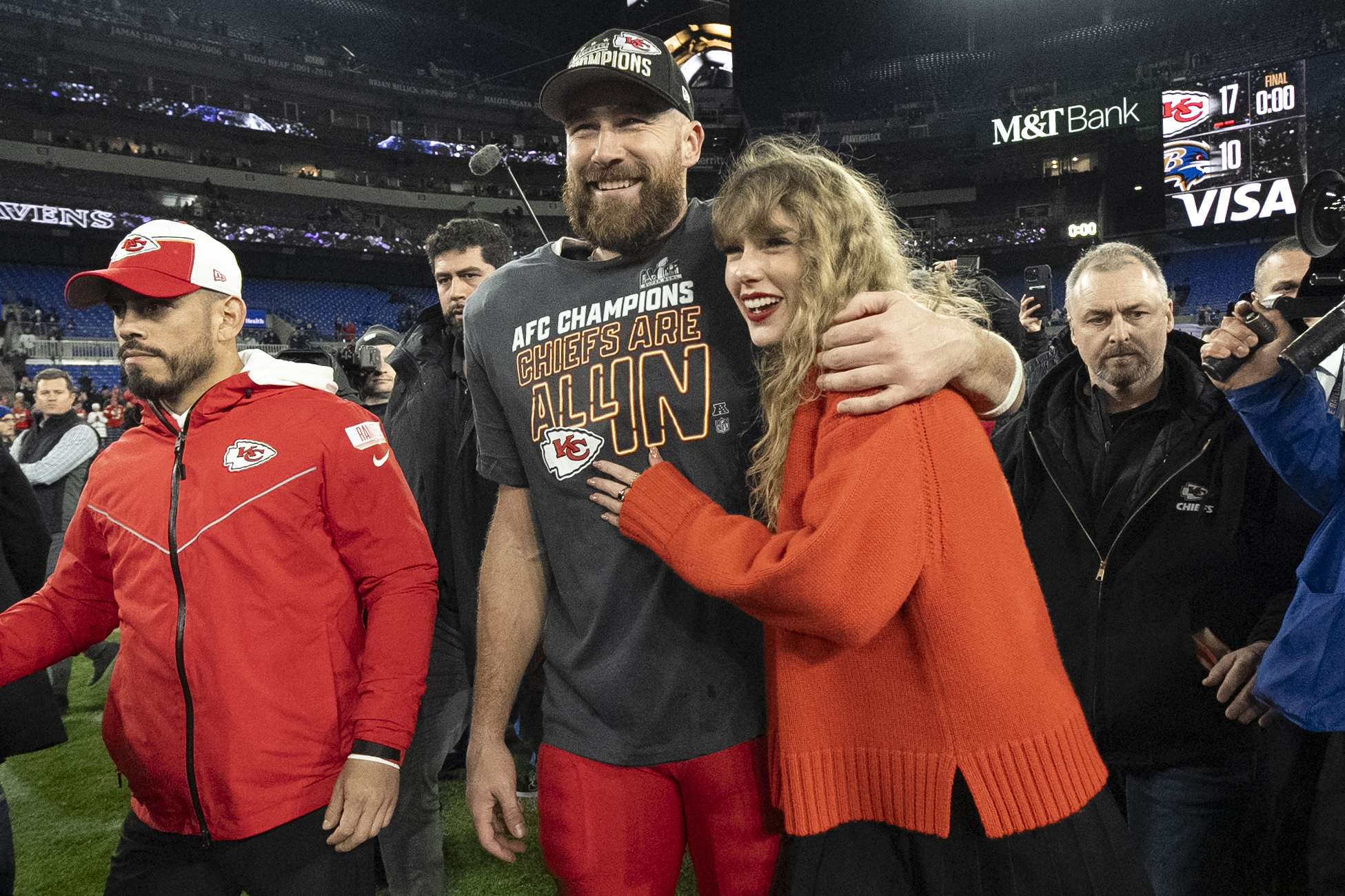 Kansas City Chiefs tight end Travis Kelce walks with Taylor Swift following the AFC Championship game. Photo / AP
