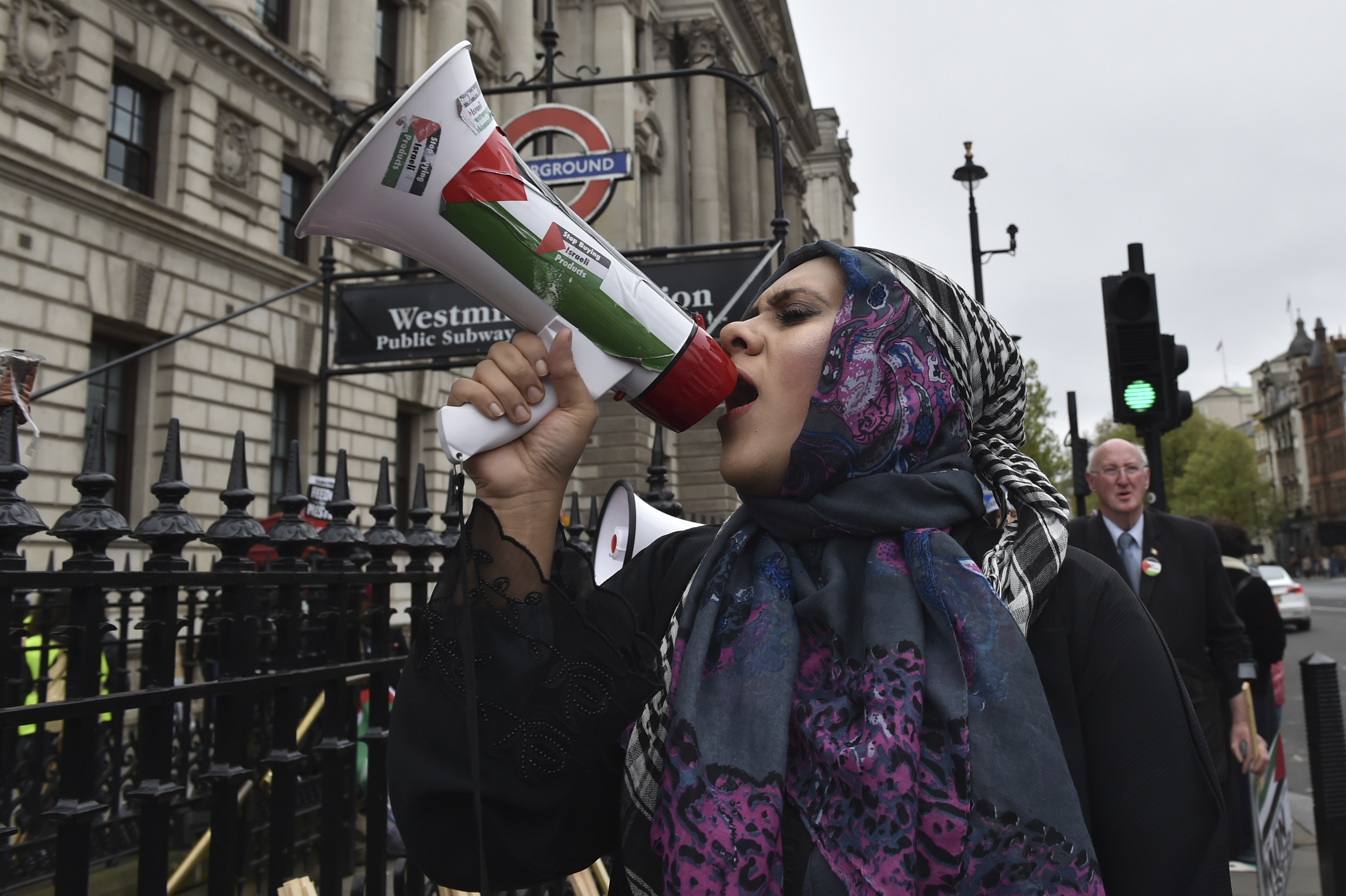 A pro-Palestinian protester holds a megaphone ahead of a march in support of the Palestinian people in Gaza. Photo / AP