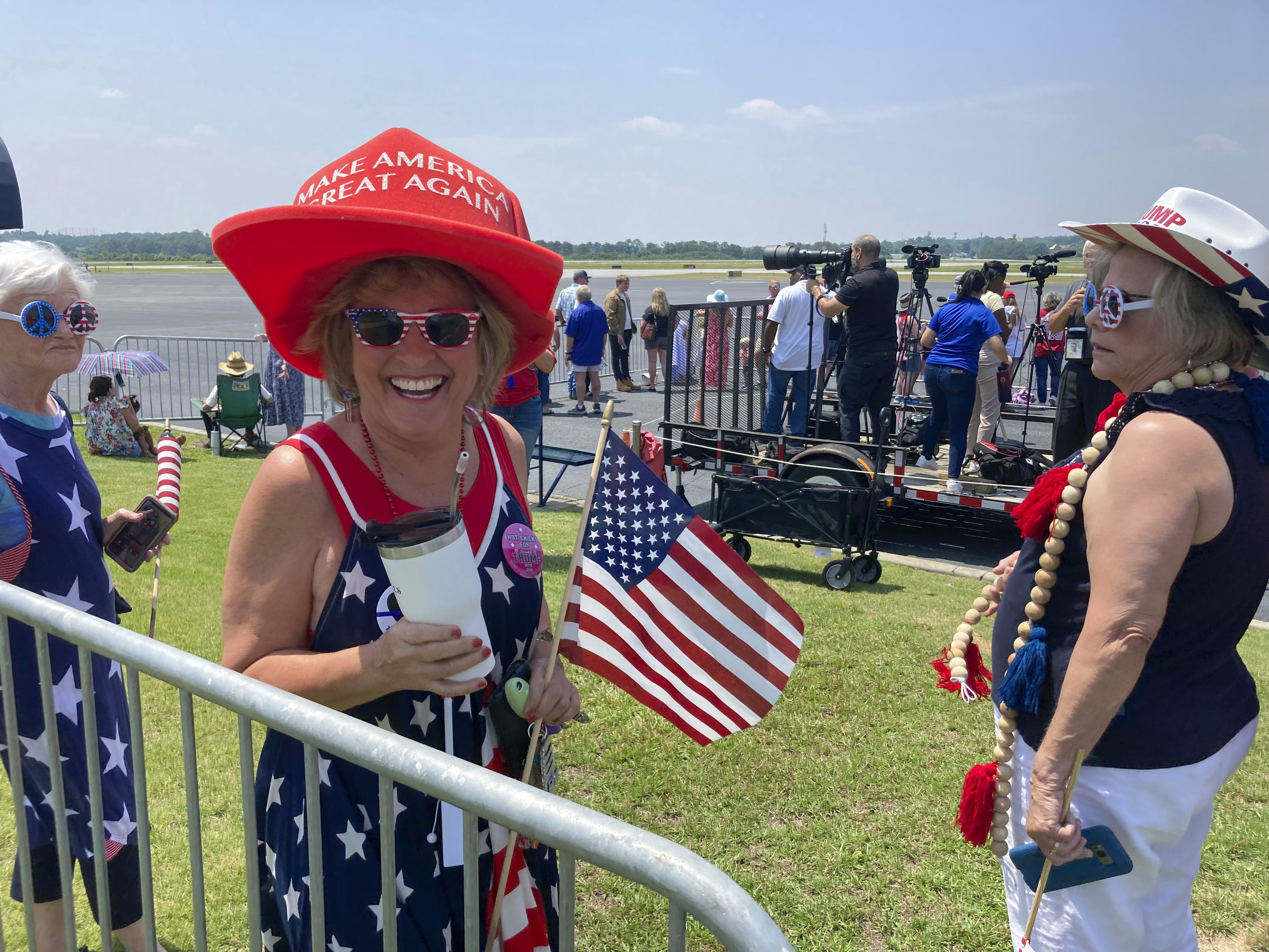 Jan Plemmons, of Columbus, waits at a private airfield in Muscogee County for former President Donald Trump’s arrival. Photo / AP