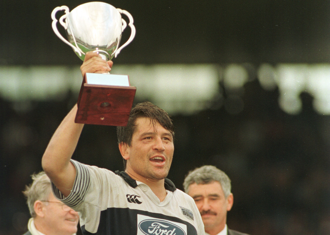 Zinzan Brooke lifts the Super 12 trophy after the 1996 final. Photo / Brett Phibbs