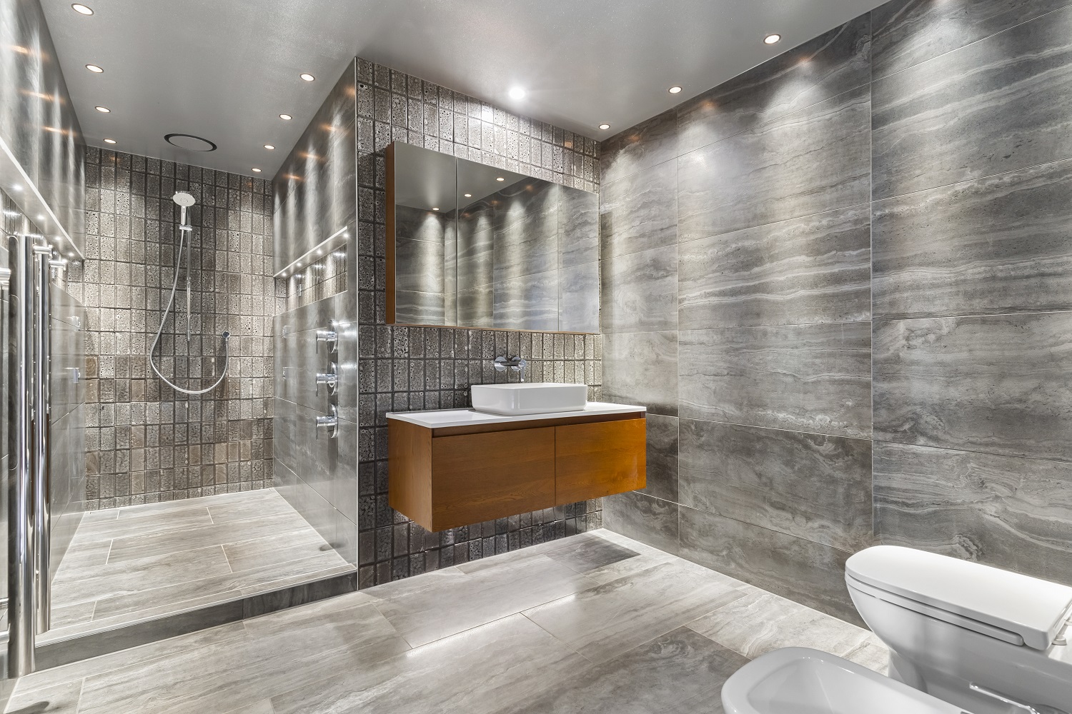 Adding a hand shower is usually a good idea – you can point the spray anywhere, and it makes cleaning the shower much easier.  Photo / Bladescenes