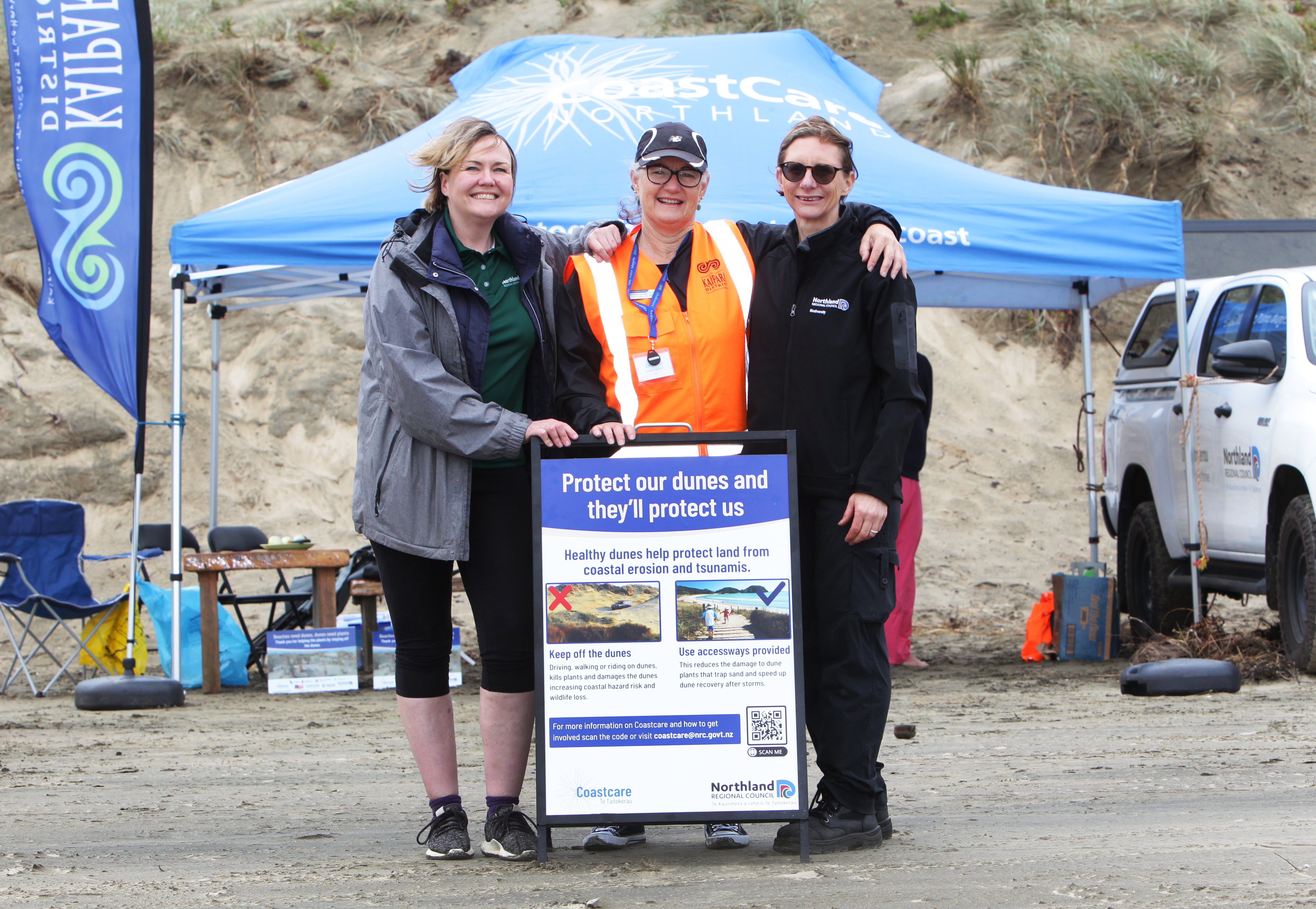 Millie Kenyon from the NRC , Amanda Bennett, KDC and Laura Shaft from the NRC on Ripiro Beach on Saturday to welcome visitors and remind them of their safety obligations on the beach