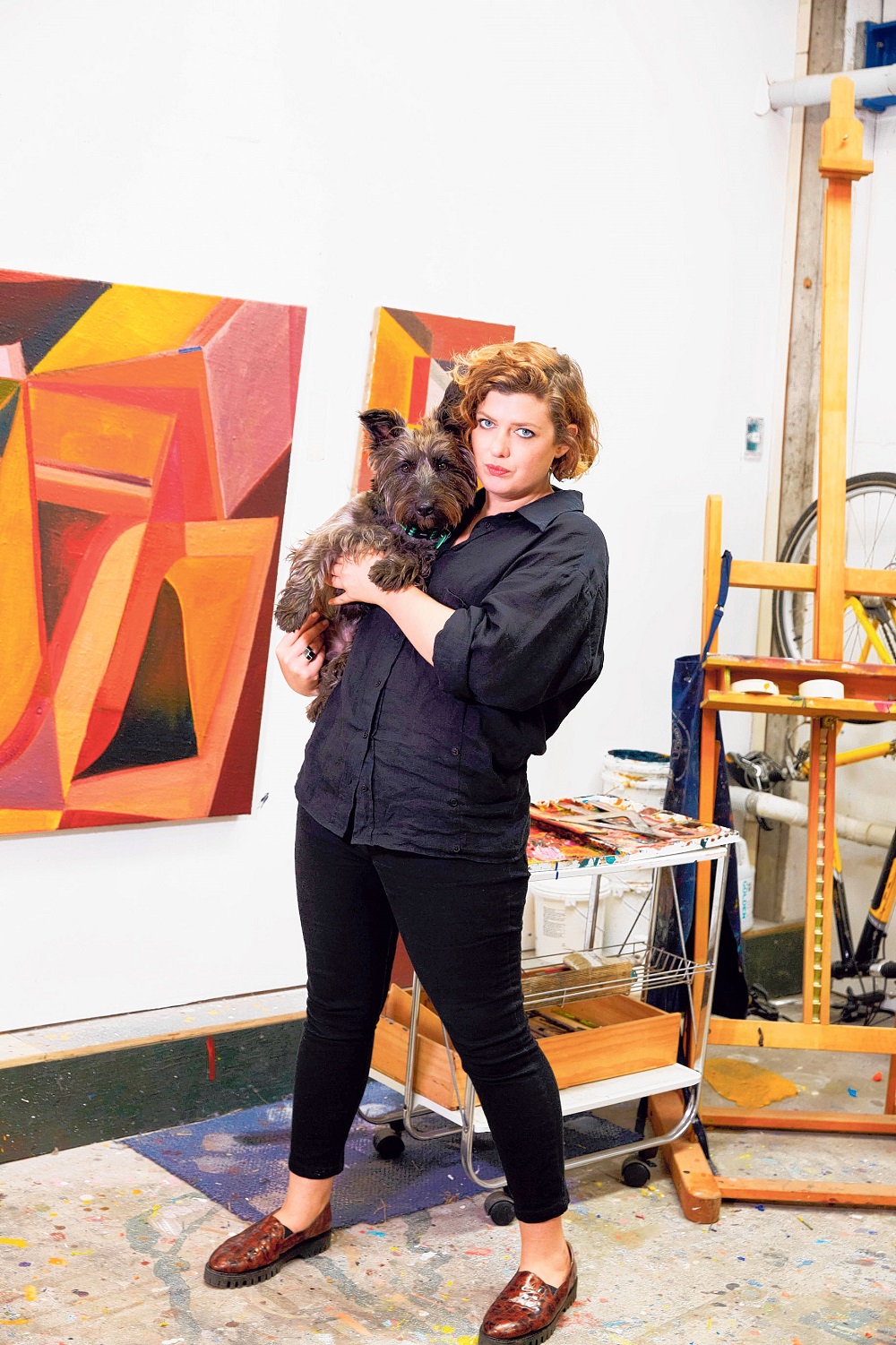 Imogen and Dusty in her studio at Corbans Estate Arts Centre in Henderson. Photo / Rebecca Zephyr Thomas