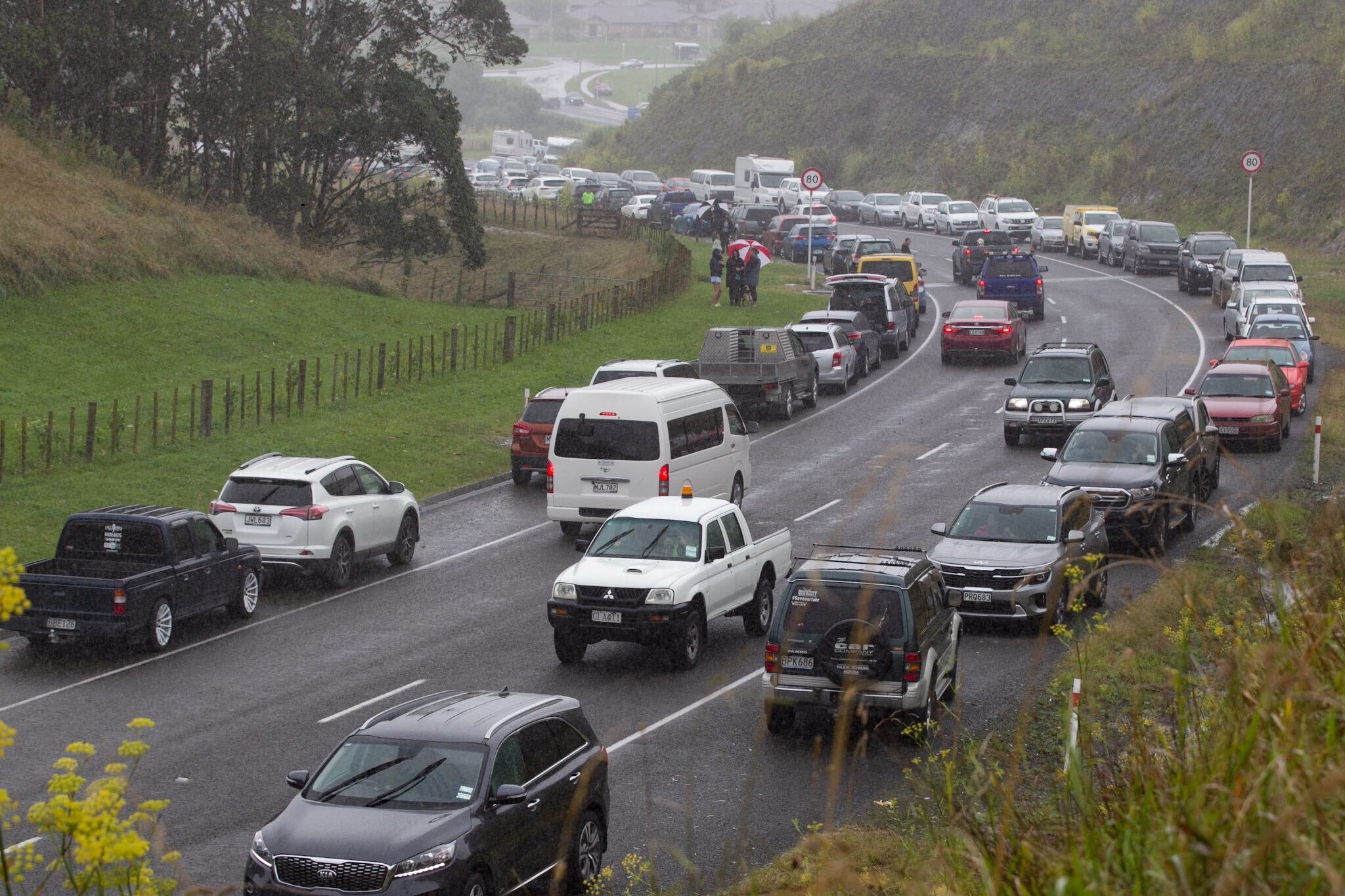 Evacuees parked up in Puketitiri Rd near Greenmeadows in Napier. Photo / Warren Buckland
