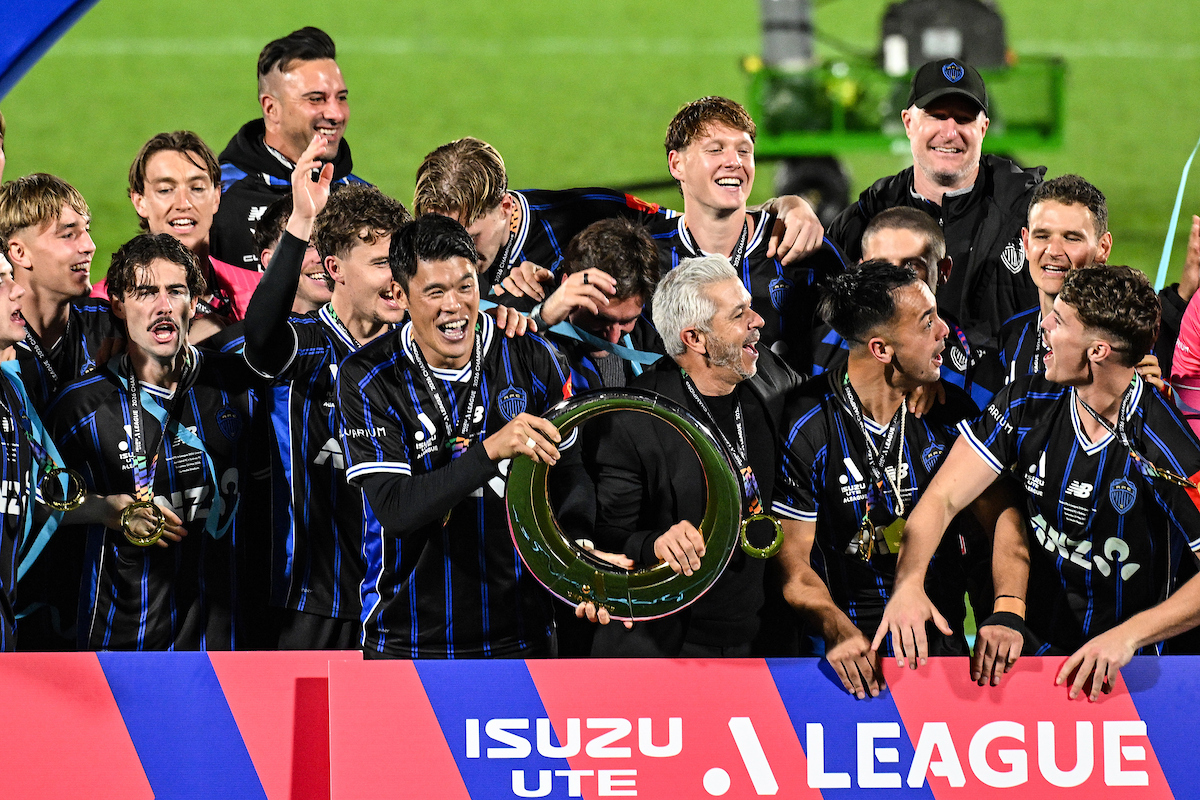 Hiroki Sakai and the Auckland FC team celebrates with the A-League trophy after defeating Sydney FC in the A-League Grand Final. Photo. / Photosport