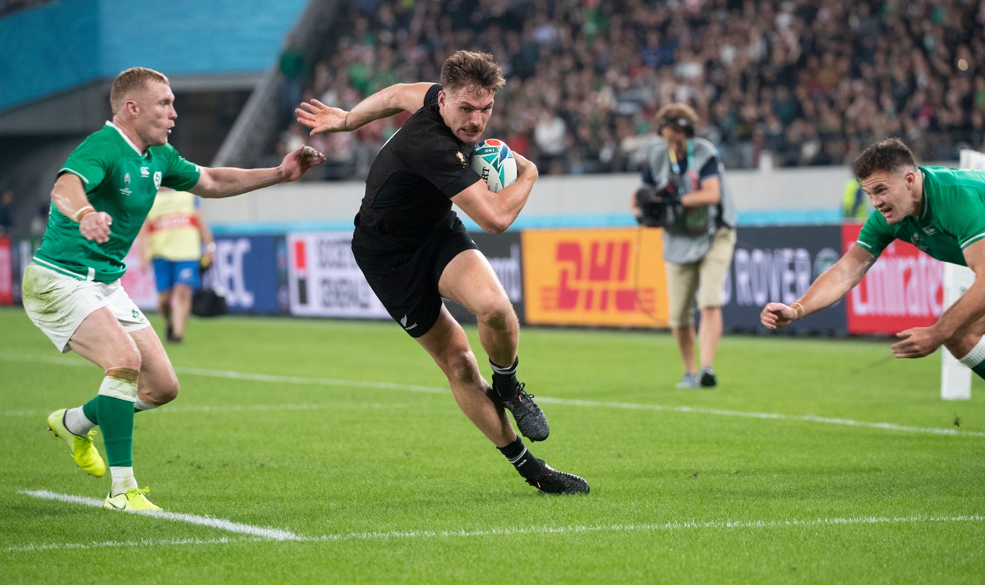 George Bridge setting up Aaron Smith's second try against Ireland in Tokyo. Photo / Mark Mitchell 