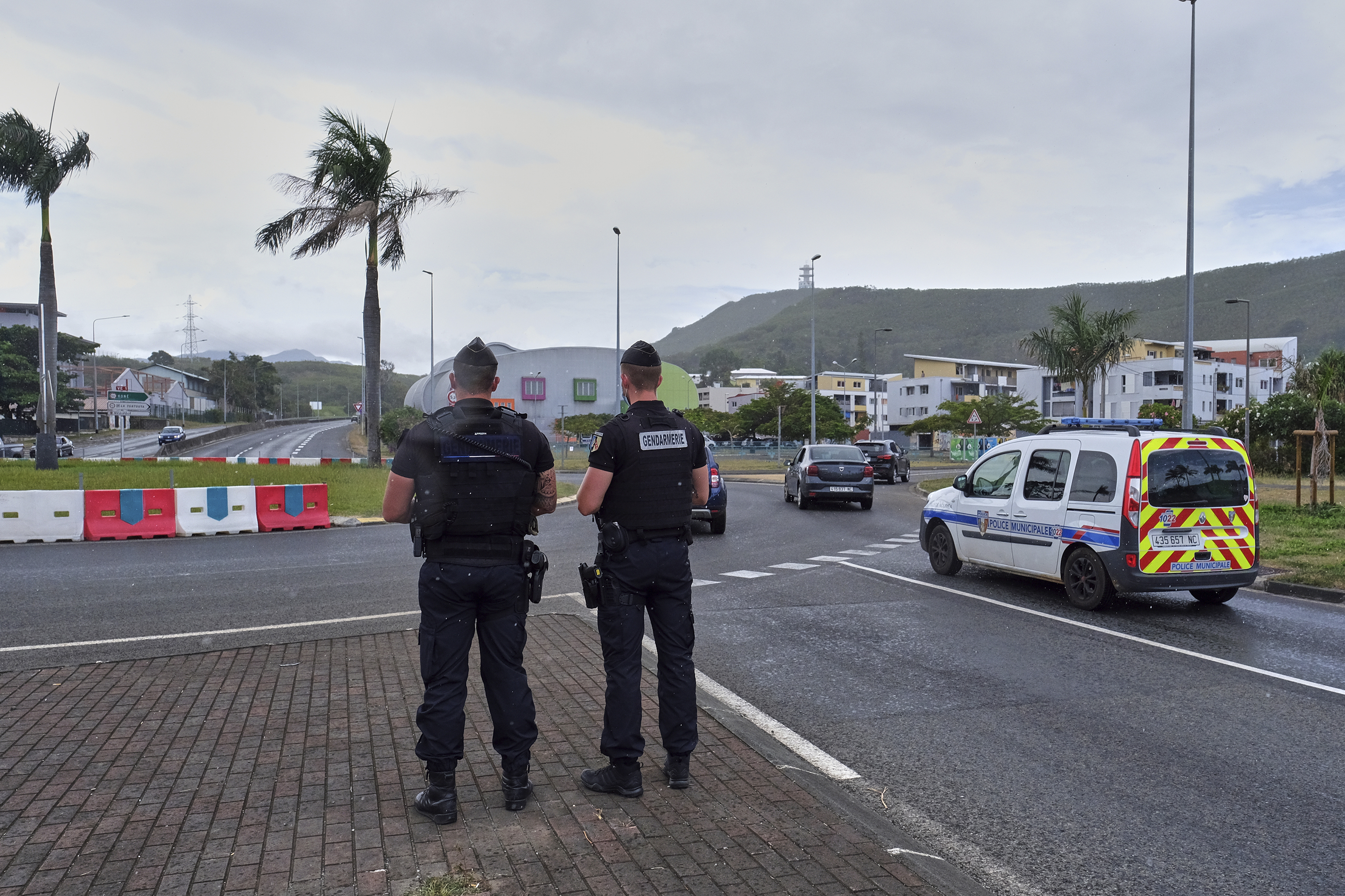 French gendarme (police) stand patrol at a roundabout in Noumea, New Caledonia. Photo / AP Clotilde Richalet