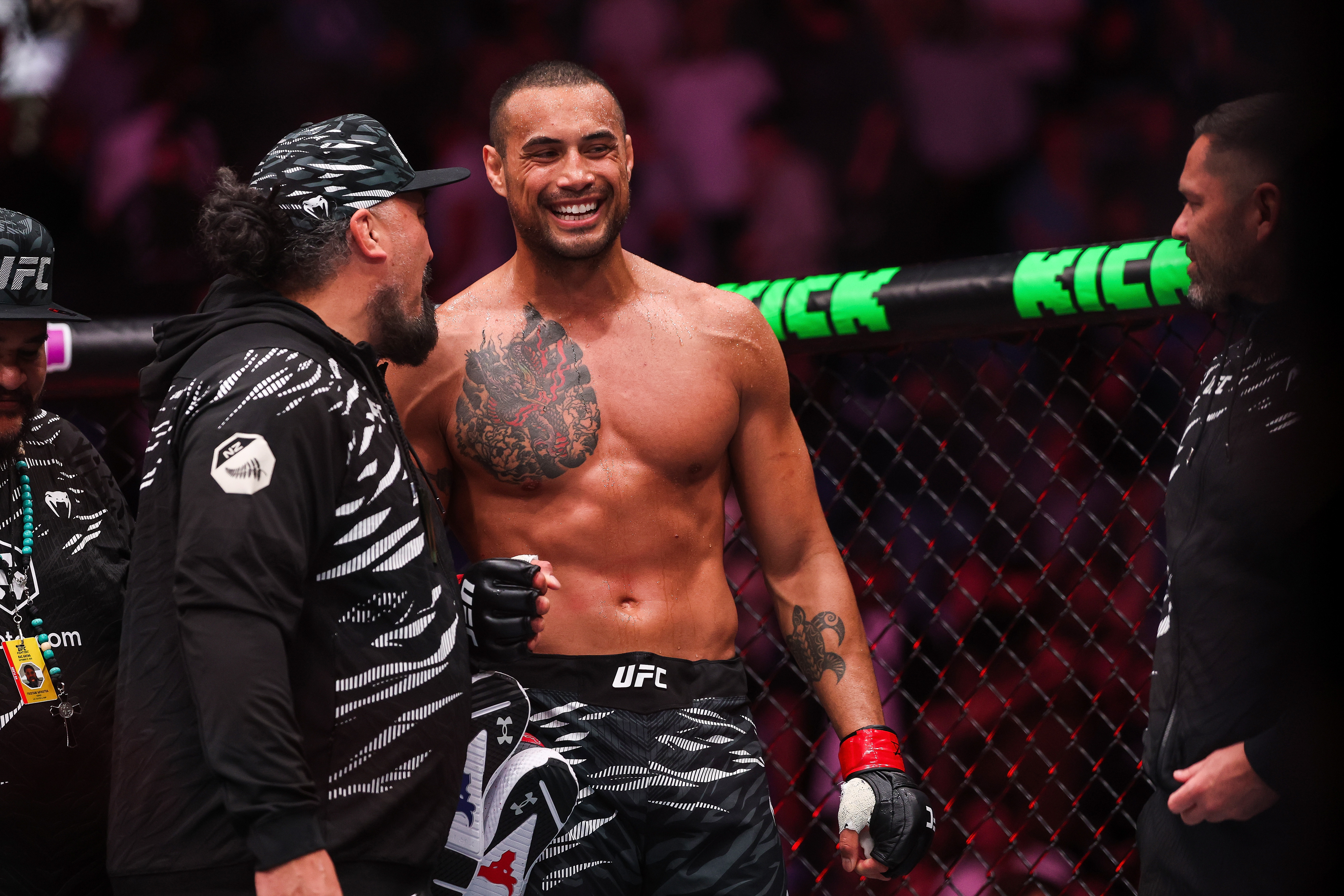 Carlos Ulberg and City Kickboxing head coach Eugene Bareman react after Ulberg's win over Dominick Reyes. Photo / Photosport