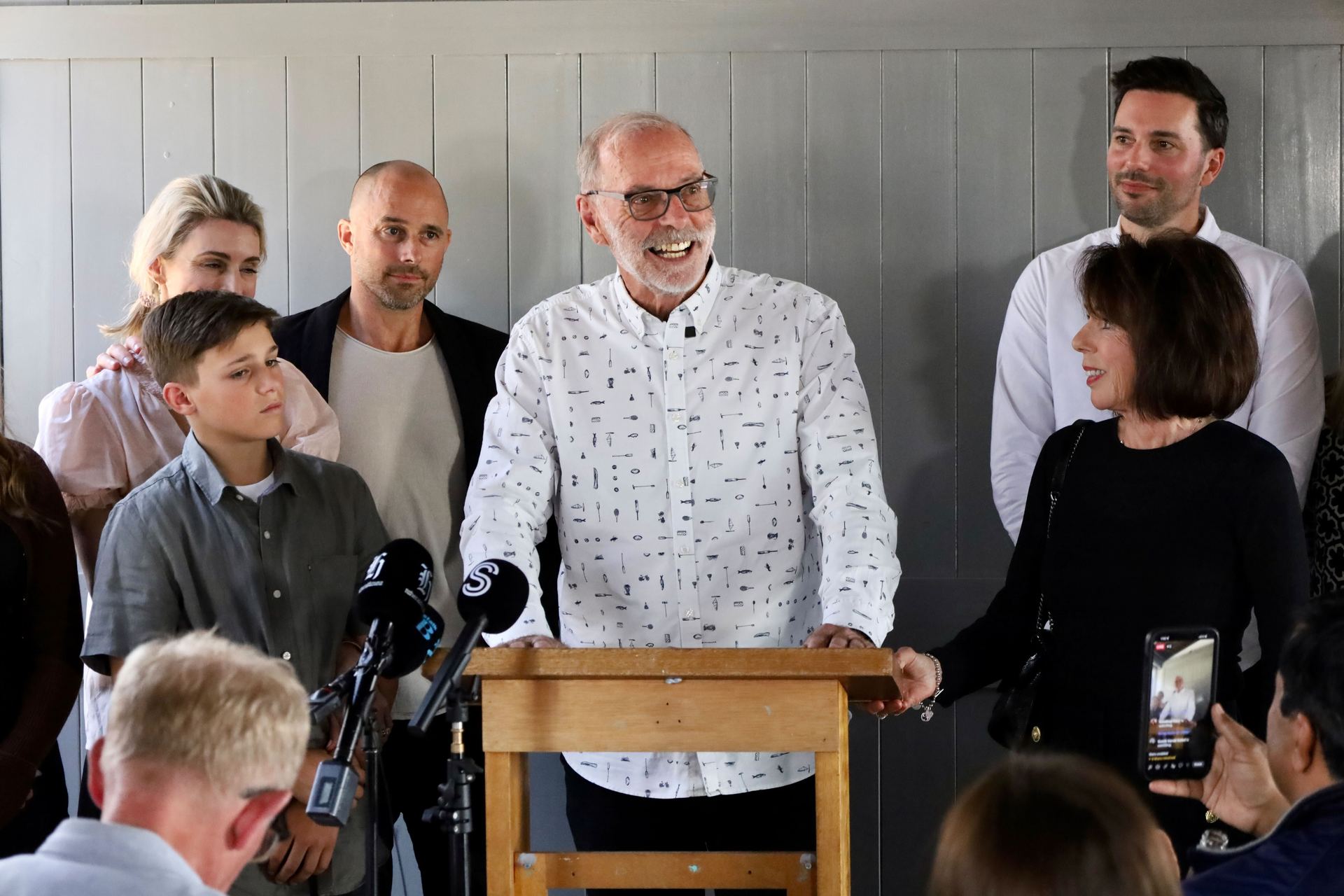 Wayne Brown addresses the media surrounded by his family, including wife Toni (right). Photo / Jed Bradley