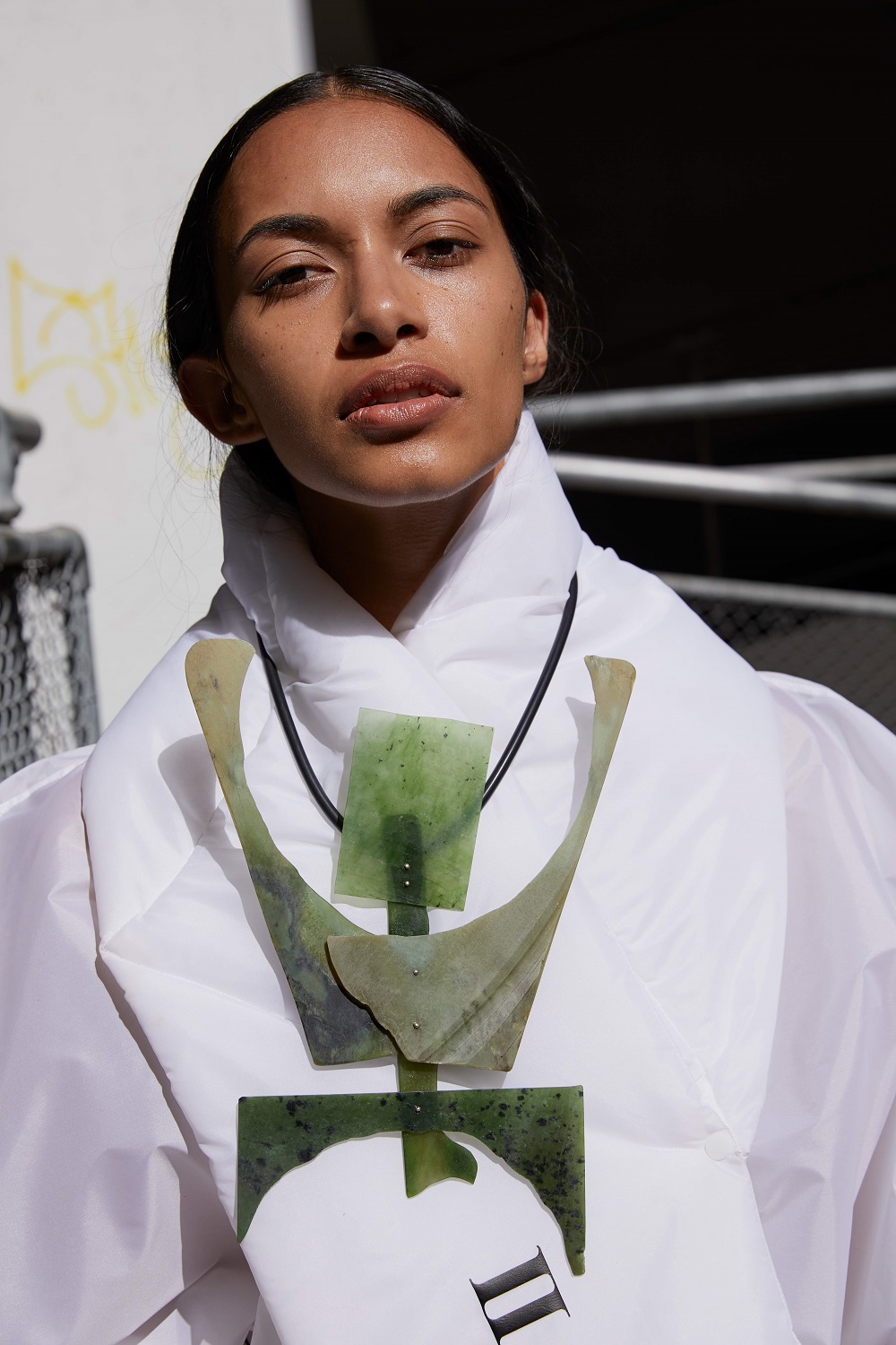 A Shona Tawhiao dress and Neil Adcock pounamu pendant, part of a new fashion exhibition Moana Currents: Dressing Aotearoa Now. Model / Layla from Unique Model Management. Photo / Mara Sommer