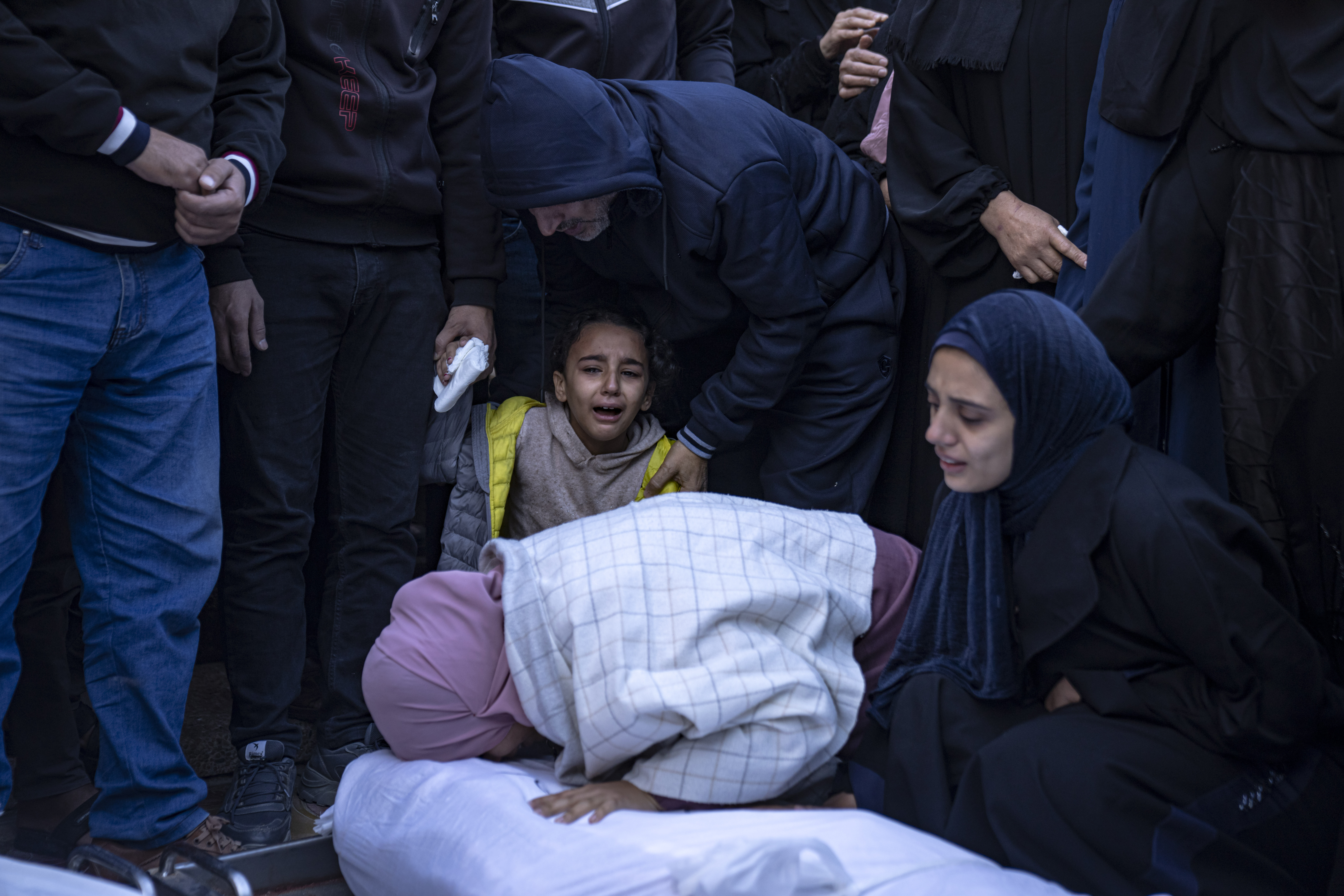 Palestinians mourn their relatives killed in the Israeli bombardment of the Gaza Strip, in the hospital in Khan Younis. Photo / AP