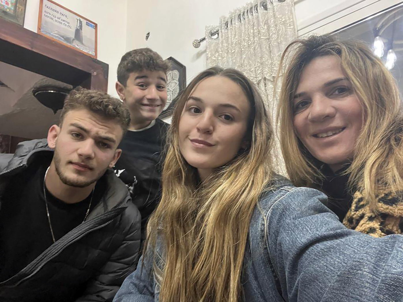 This undated family photo provided on October 16, 2023 shows Maya Regev, 21 (centre) and Itay Regev, 18 (left) with their mother and a brother. The Regev family says Maya and Itay were abducted at the Tribe of Nova music festival and taken to Gaza, but have no further word on their conditions.  Photo / Regev Family via AP