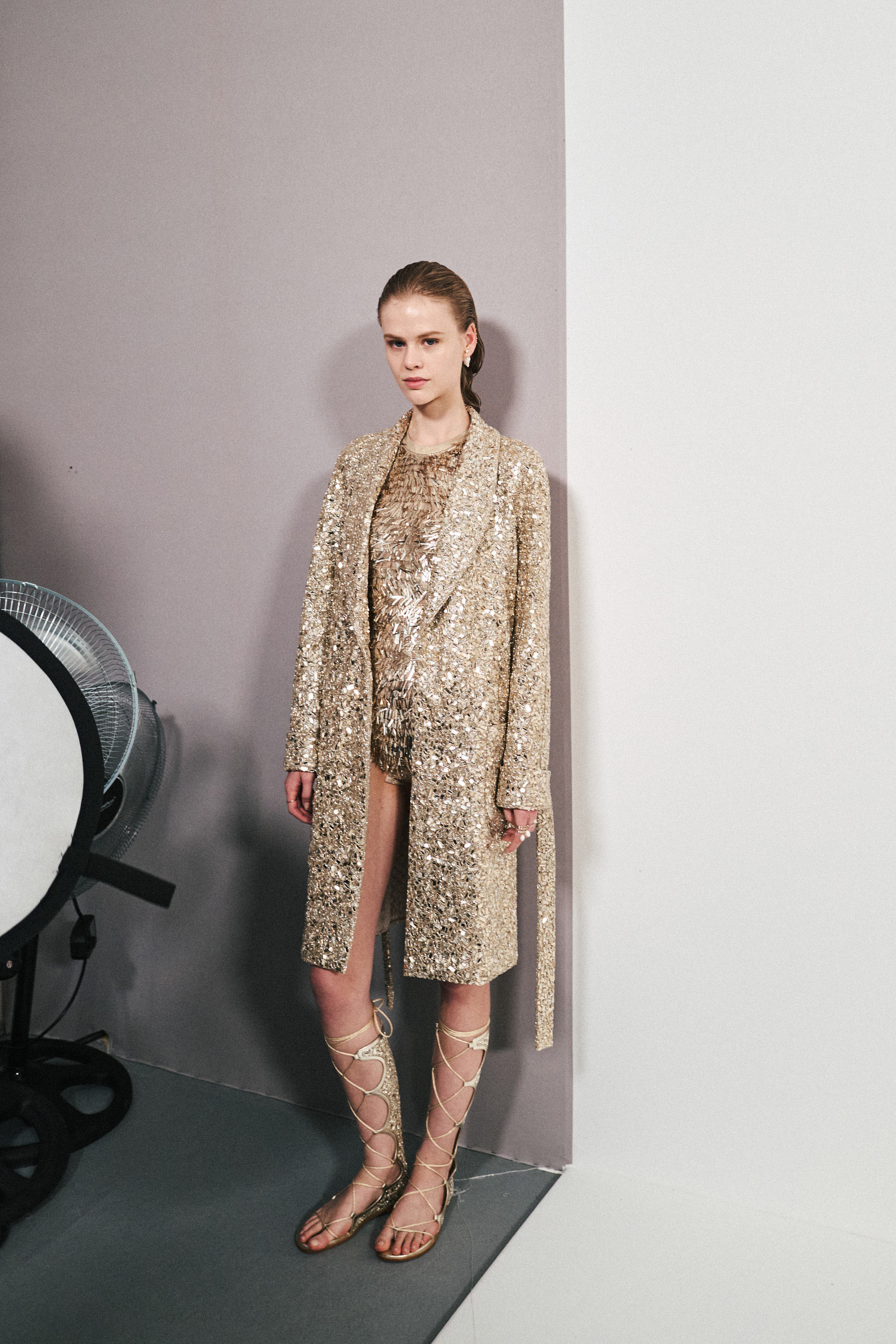 A shimmering Dior trench jacket with a matching bodysuit. Photo / New York Times