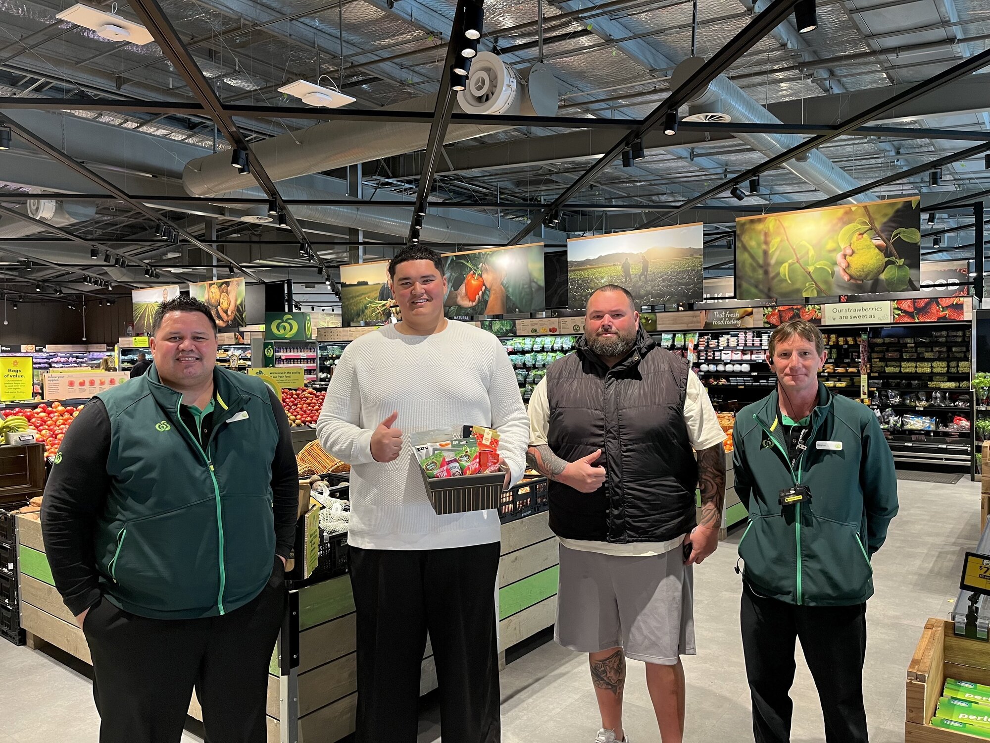 Woolworths Fenton St store manager Justin Herewini (left), Colin Dorreen jnr, his father Colin Dorreen snr, and fresh foods manager Clayton Fischer gather for Colin jnr's job interview. Photo / Annabel Reid