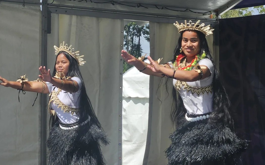 A young Kiribati duo graces the stage, sharing their traditional dance forms with a crowd of thousands. Photo / RNZ/Tiana Haxton