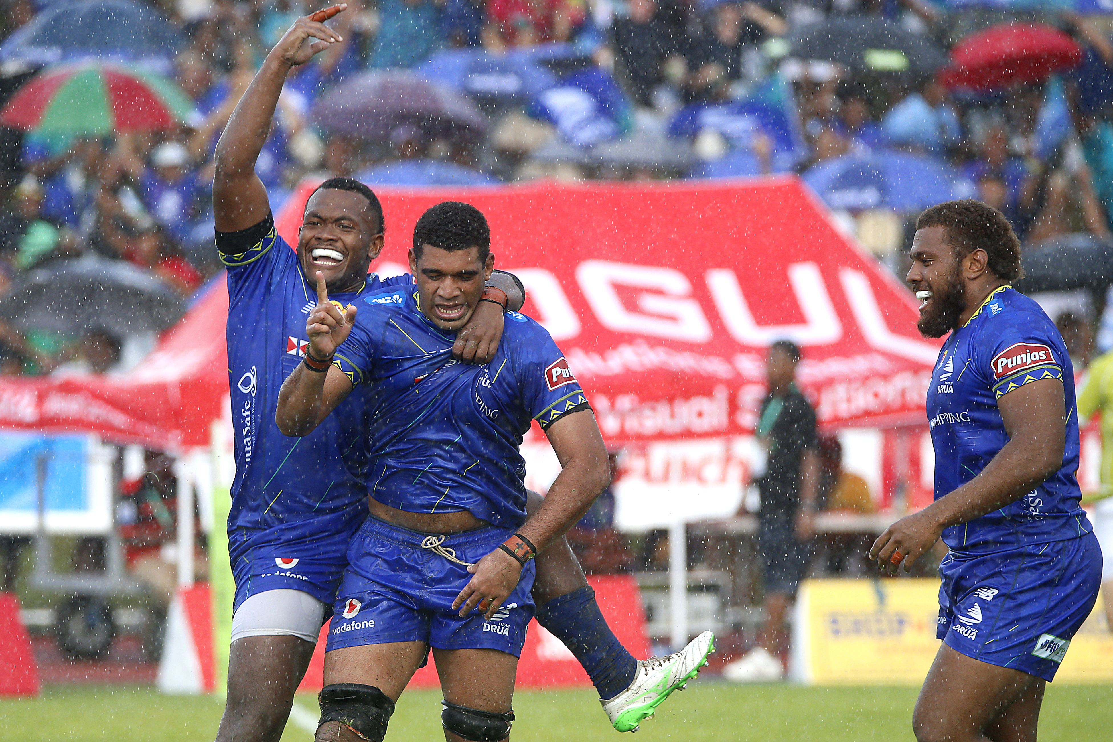 Meli Derenalagi of Fijian Drua celebrates with teammates after scoring. Photo / Getty Images
