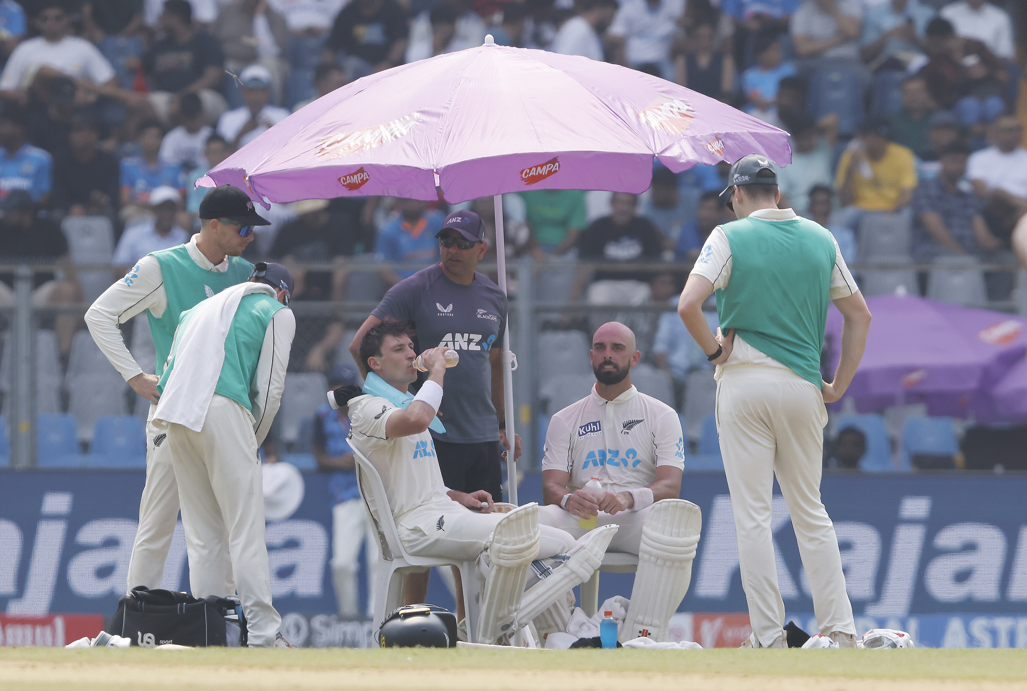 Will Young and Daryl Mitchell battle the heat of Mumbai. Photo / Photosport
