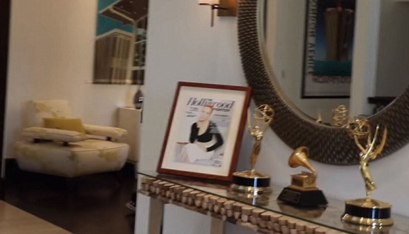 Kathy keeps two Emmys, a Grammy, and her framed Hollywood Reporter cover on a table inside her home. Photo / YouTube